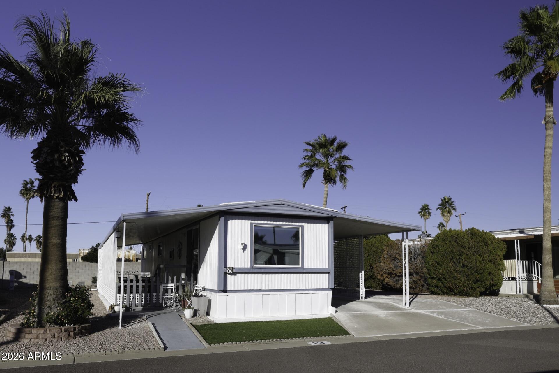 Seller motivated has priced this home competitively for a timely sale and welcomes strong offers. 

Quiet Street and Large Lots. Welcome to this adorable 2-bedroom, 1-bathroom single-wide manufactured home nestled on a peaceful end street.  Sits on a very Large lot for rent/lease from Community.  Move-In Ready condition.  Accessible from Loop 202 to all major roadways.  

With 720 square feet of cozy comfort, this home is full of charm and easy living! Step inside to find newer windows letting in loads of natural light, central A/C to keep you cool all summer, and a washer & dryer included, it's all here and move-in ready! Enjoy your morning coffee or evening breeze on the covered patio, and you'll love the convenience of covered parking too.