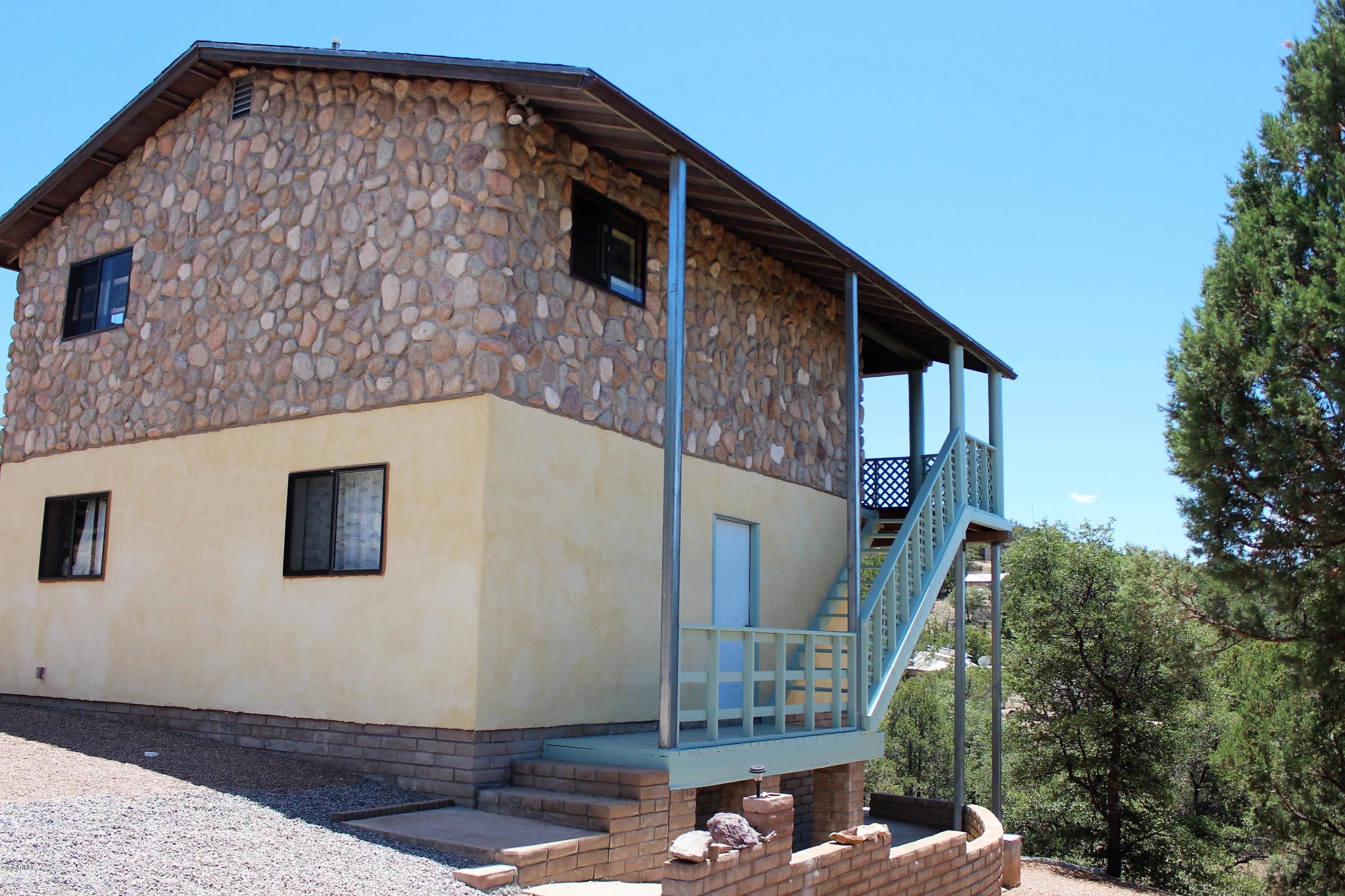 We are ''REELING'' over this private cabin by the lake. Sitting on 3 lots this 2 story beauty has it all. 3 bedrooms and 1 bathroom downstairs to utilize the cool temperatures. Spacious living and dining room upstairs and another bathroom off the large kitchen. Powered by owned solar panels. Onsite 2 car garage is perfect to store your boat. 2 property well share located on this property also powered by solar. A true display of labor of love- custom rock work on the exterior and interior, tongue and groove wood panels throughout, one of a kind copper plates inset in the dinning room walls makes this place a ''CATCH OF THE DAY''. Just a short distance to the Parker Lake marina- shop, fishing, docking and launching. These opportunities don't happen often contact me today to ''HOOK'' this one