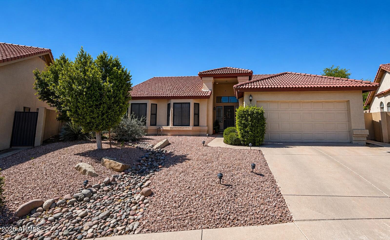 Opportunity meets character in this single-level home with vaulted ceilings, spacious living areas, and a unique wood-accented archway. Functional layout offers multiple living spaces and strong upside potential. Kitchen features ample cabinetry, generous counter space, and flows into the family room. Primary suite includes dual sinks, separate tub/shower, and ample closet space. Secondary bedrooms are versatile for guests or office use.
Located in Mountain Park Ranch, enjoy 3 pools, 3 parks, 3 tennis courts, and miles of trails near South Mountain Park. Close to freeways, shopping, and dining. Located in the Kyrene School District (buyer to verify).
Ideal for investors or buyers looking to personalize in a highly desirable community.