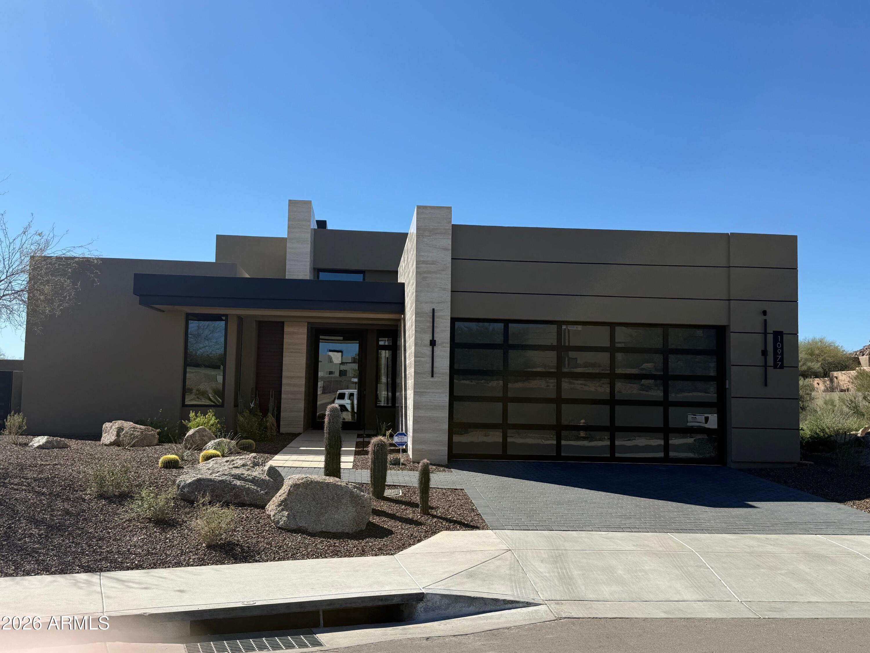 Serene is a new gated enclave of 21 cutting edge single level contemporary homes designed by Swayback Architects and built by Sonora West Development. The lavish interior finishes are created by renown interior designers Est Est. This Model C comes with 3 bedrooms plus an office, pool allowance, landscaping, Sub-Zero & Wolf Appliances Backing to the North side of Pinnacle Peak Mountain, Serene is close to shopping, restaurants and over two dozen private and public golf courses.