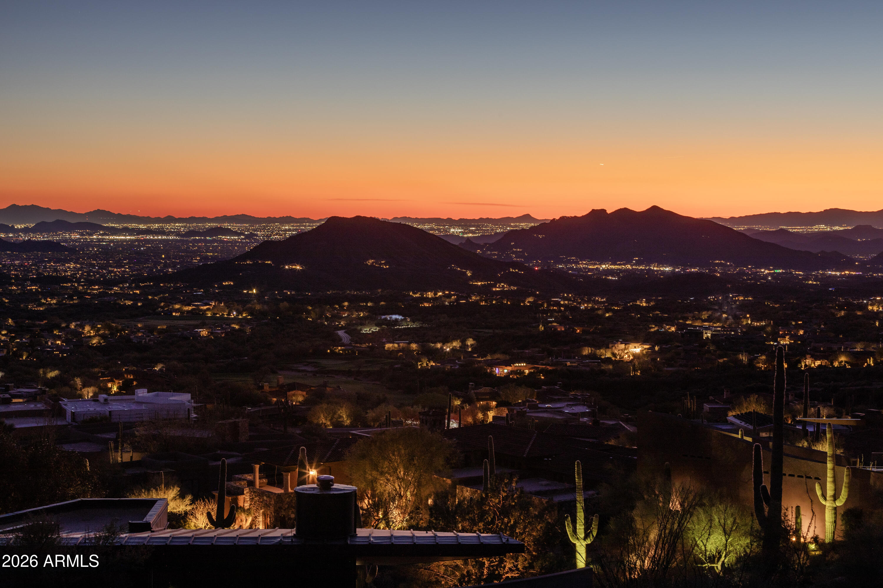 Nestled high in the prestigious Desert Mountain community of North Scottsdale lies one of the most captivating remaining homesites in the exclusive Sunset Canyon village. This 1.31-acre lot sits elevated in Sunset Canyon, one of the most desirable villages within the Desert Mountain community in North Scottsdale. At roughly 3,490 feet in elevation, it offers clear, wide-ranging views across the Valley. You can see Four Peaks, the McDowell Mountains, Lone Mountain, Apache Peak, several golf courses, and a spectacular view of those Sunset Canyon Sunsets. Lots with this kind of elevation, location, and combination of views are becoming scarce in the area. The building envelope measures 18,080 square feet, which gives plenty of room for a custom home. The site works well for a single-level design that takes full advantage of the outlook, or a multi-level layout where the lower level still captures good southern and eastern light and views.
Sunset Canyon is positioned conveniently within Desert Mountainclose enough to the clubhouses,  fitness facilities, and trails, yet still a short drive from the main gates. That balance of access and privacy appeals to many who build here.
An adjacent 3,990 sq ft contemporary masterpiece is also available from the same owner. If both the lot and the house are purchased together, there may price consideration. 

See boundary and topographical survey in Document Section 

See Video in Media Section