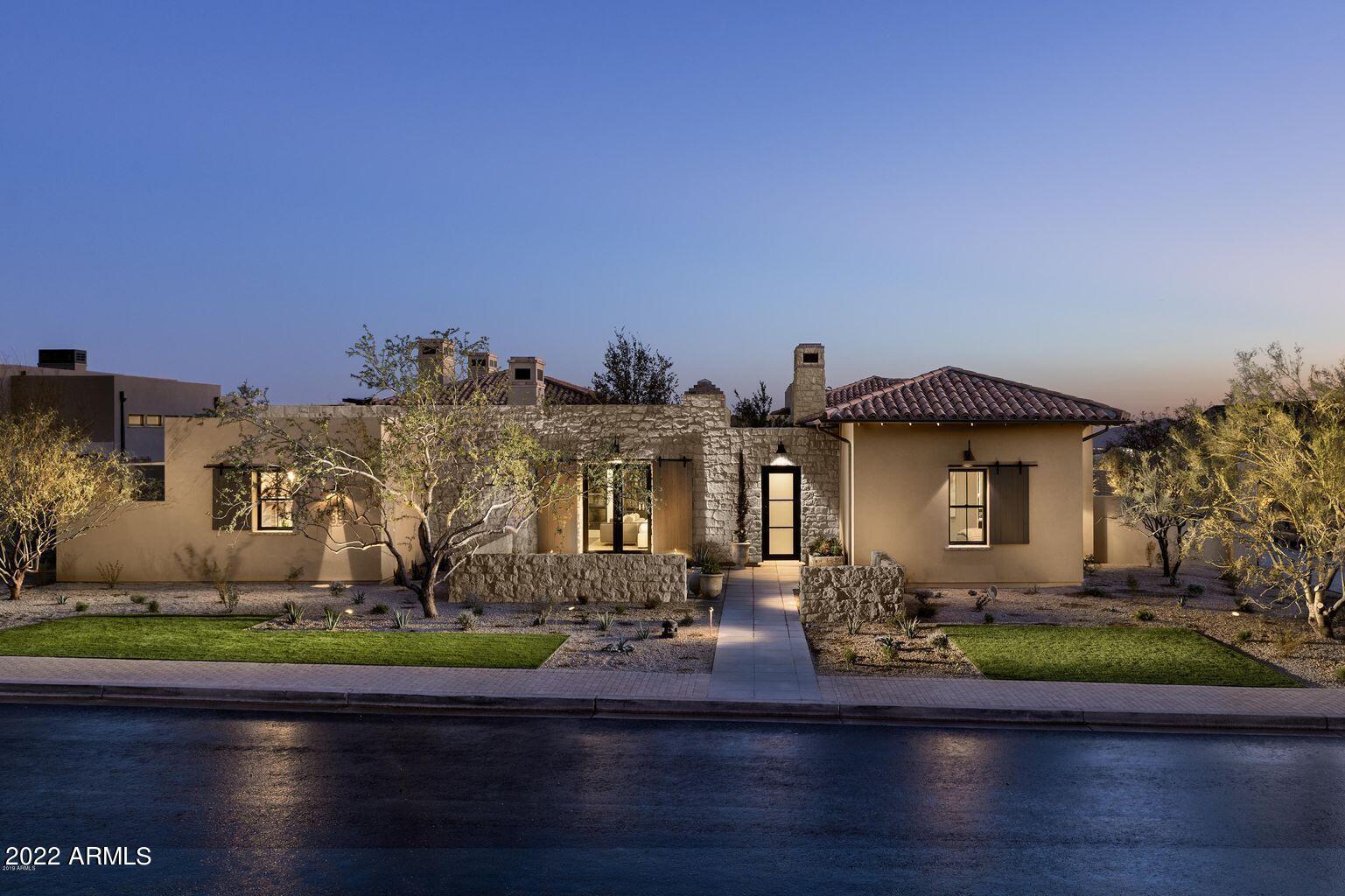 The Equus model at WHITE HORSE is indoor/outdoor living at its finest from the prestigious Camelot Homes, Arizona's award winning builder. This former model home is loaded with upgrades.  Custom wood beams throughout, 2 fireplaces, pool and spa outdoors.  Media room, wine room and three bedrooms are in the main house .  Guest house has its own private entrance  The City lights/Mountain Views are spectacular. More photos coming soon - April 7!