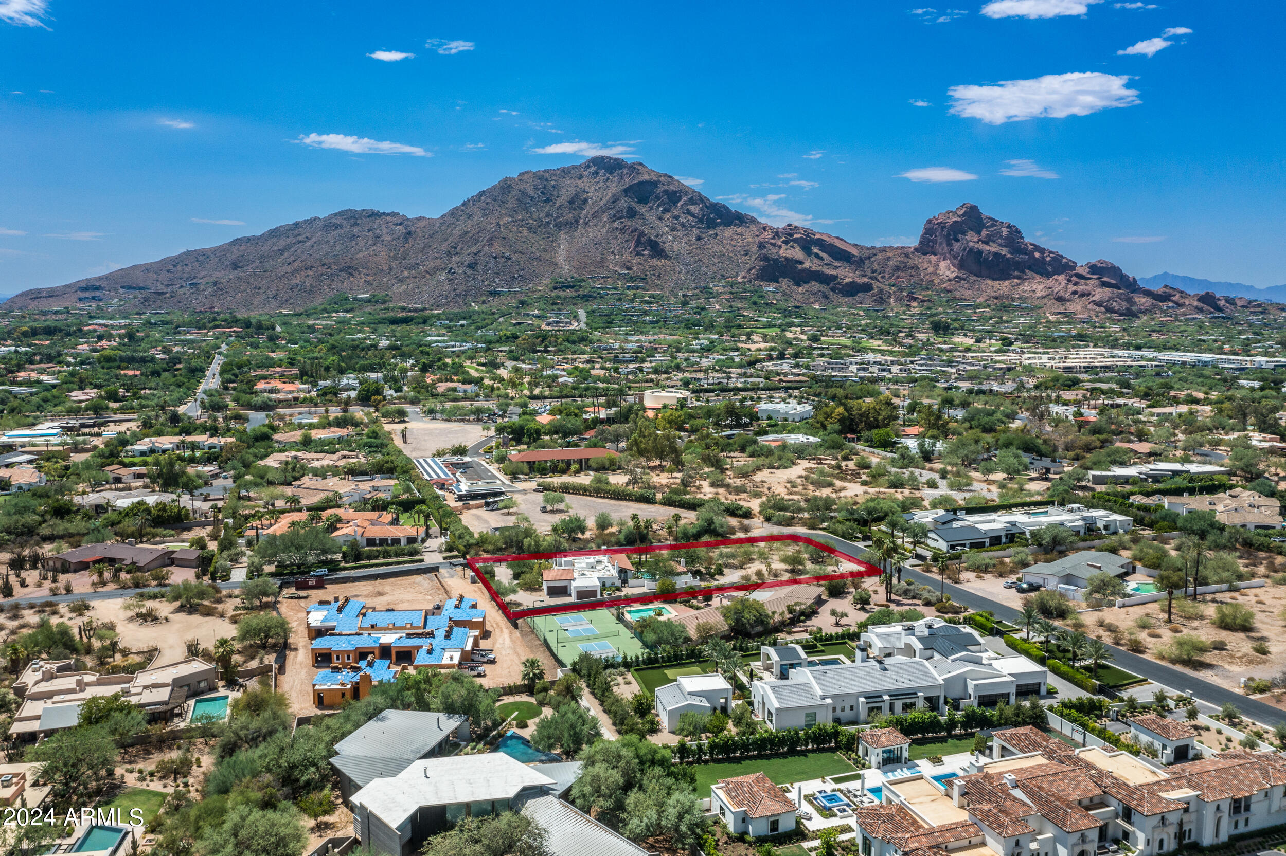 The best Camelback view lot in Paradise Valley.  This plot of land is an exceptional opportunity located on one of the most prestigious and quiet streets in arguably the best part of town. The lot is flat and easy to build on, making it an ideal foundation for your dream home. It offers incredible, unobstructed views of Camelback Mountain. The neighborhood is very exclusive, including a new build valued at over $13 million, highlighting the high-end nature of the surrounding homes. This is truly a prime location in Paradise Valley, offering both luxury and tranquility.  House on property is in great shape as well!  Will go quick at this price.

*HOME IS OCCUPIED.  DO NOT WALK ON THE LOT WITHOUT PRIOR APPROVAL.