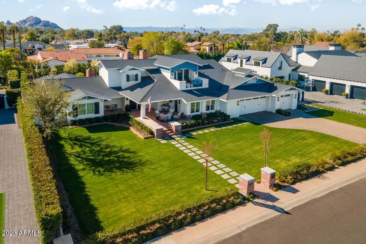 No detail overlooked or quality spared in this sophisticated designer home in the heart of Arcadia!  Offering million dollar views, this spacious family home, ideally situated in a quiet cul de sac features 5350 square feet with 5 bedrooms and 7 bathrooms and sits on a generous half acre lot! Highest level of finishes installed with wide plank, white oak flooring, custom cabinetry, new Wolf appliances, custom light fixtures throughout, a wired and installed Control4 system including Samsung Frame TV's and security system. The main floor features 4 bedrooms plus an office (can easily be 5 beds as it's an en suite with walk in closet), spacious kitchen and family room and stunning dining room overlooking the lush rear yard. Serene primary suite with separate sitting area, with gas   fireplace, light and bright bath with double sinks large soaking tub and generous walk in closet. The upstairs is a show stopper with large game room and separate media room with black out shades, projector and screen, reclining sofas and a built in bar!  Rare 1/2 acre with south back yard, large brick fireplace, loads of patio seating, newly planted screen hedge and plenty of room for a pickle ball court or pool of your dreams!  Impossible to list all of the upgrades in this move in ready home - please see amenities list in the document tab!