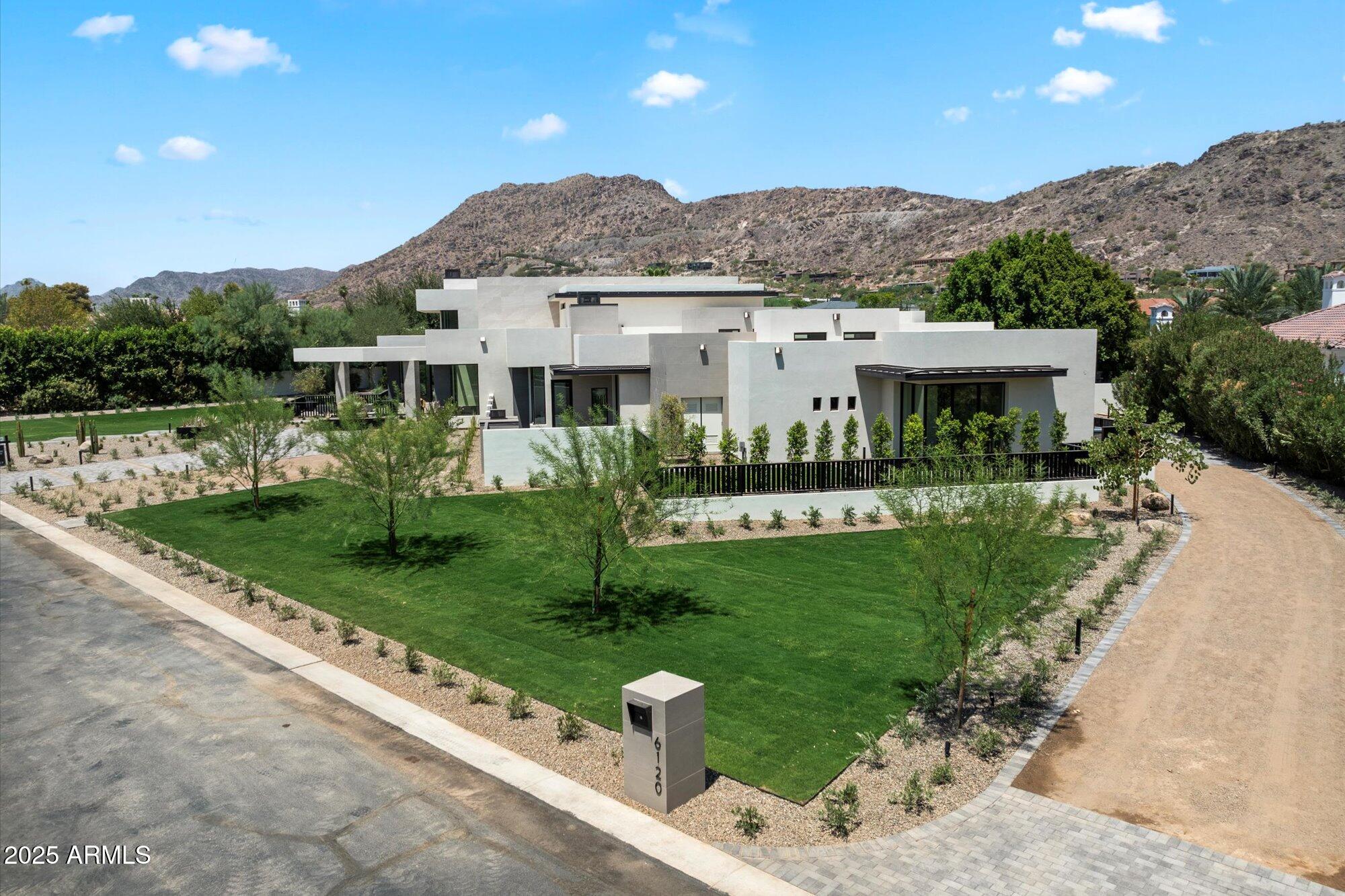 MOTIVATED SELLER! 
SELLER WANTS IT SOLD BEFORE END OF YEAR!  
This soft desert contemporary by Arcadia Building Co, seamlessly blends timeless elegance with contemporary luxury. Main House offers 4 En-suites, 5 Bathrooms, 1 Office, 1 Gym, 1 Game Room, 2 rooftop decks, and a 4 Car Garage. The Detached Guest House boasts 1 Bedroom 1 Bathroom and a kitchen/Great Room. The LOCATION is the best in town, offering views, and convenience to world class dining, shopping, entertainment, golf, resorts, arts, and ease of travel to private and international airports only 15 minutes away. Experience Arizona's indoor and outdoor lifestyle, truly your own Paradise