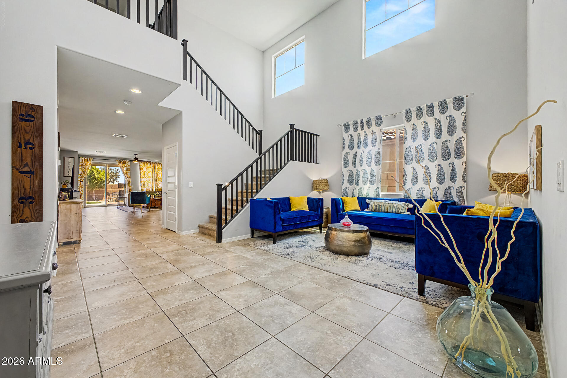 3 hr notice to show! This 6-bedroom showstopper delivers the space and style you have been waiting for. Featuring a spacious loft, oversized primary suite, granite counters, stainless appliances, and a 3-car garage, every detail is designed to impress. Located in the award-winning Alamar community with 9.5 miles of trails, 20+ parks, a private pool, pickleball courts, splash pad, fishing lake, dog parks, and the on-site Lakin Prep Academy. Easy I-10 access puts all of Phoenix within reach. This one checks every box.