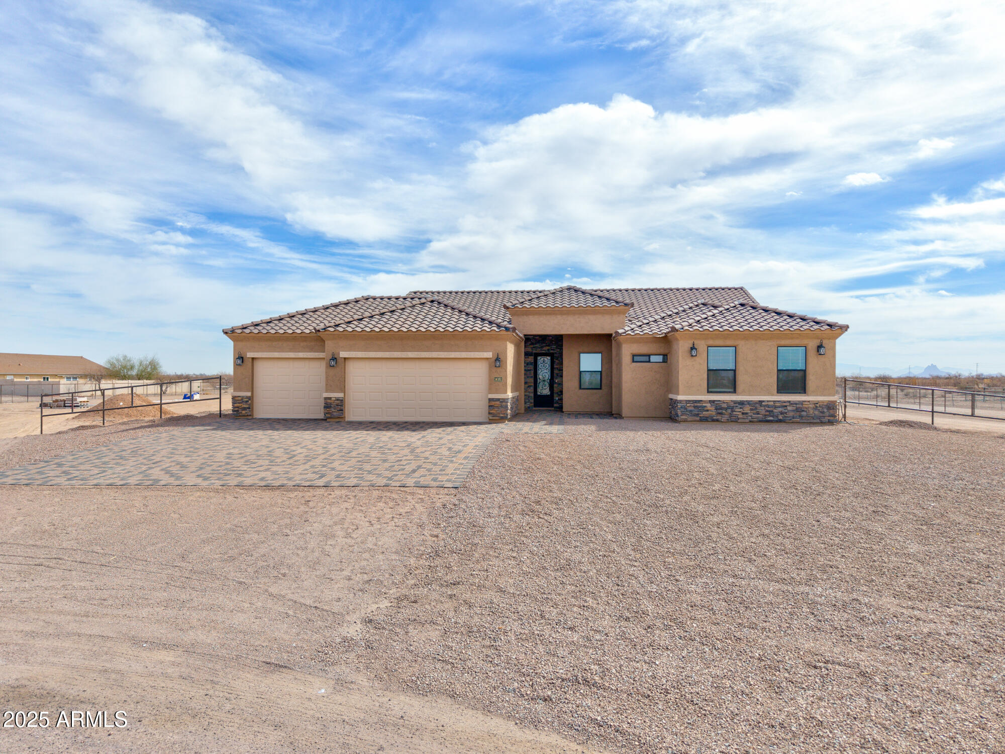 New construction on 1.25 acres with horses allowed! This thoughtfully designed 4-bedroom, 2.5-bath home offers a desirable split floor plan with 10-foot flat ceilings throughout. The spacious primary suite features a separate soaking tub and walk-in shower, along with a private exit door leading to the covered patio. Entertain with ease in the formal dining area and the large, elegant kitchen showcasing a striking waterfall island, custom finishes, and a walk-in pantry. The home is enhanced with custom steel entrance door, adding a modern and upscale touch. Outside, the property is fully pipe-fenced and includes a covered horse corral, making it ideal for equestrian living while still enjoying the comfort of a brand-new home.