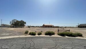 Build your dream home on this 1/3-acre lot in the fast-growing community of Arizona City. This spacious parcel offers an excellent opportunity for new construction with plenty of room for a custom residence. Conveniently located between Phoenix and Tucson, with easy access to I-10 and I-8, making commuting simple. The surrounding area continues to experience strong growth, supported by nearby major employers and new industries such as Lucid, Nikola, and Kohler. Enjoy open desert surroundings, expanding development, and long-term potential in this rapidly growing region