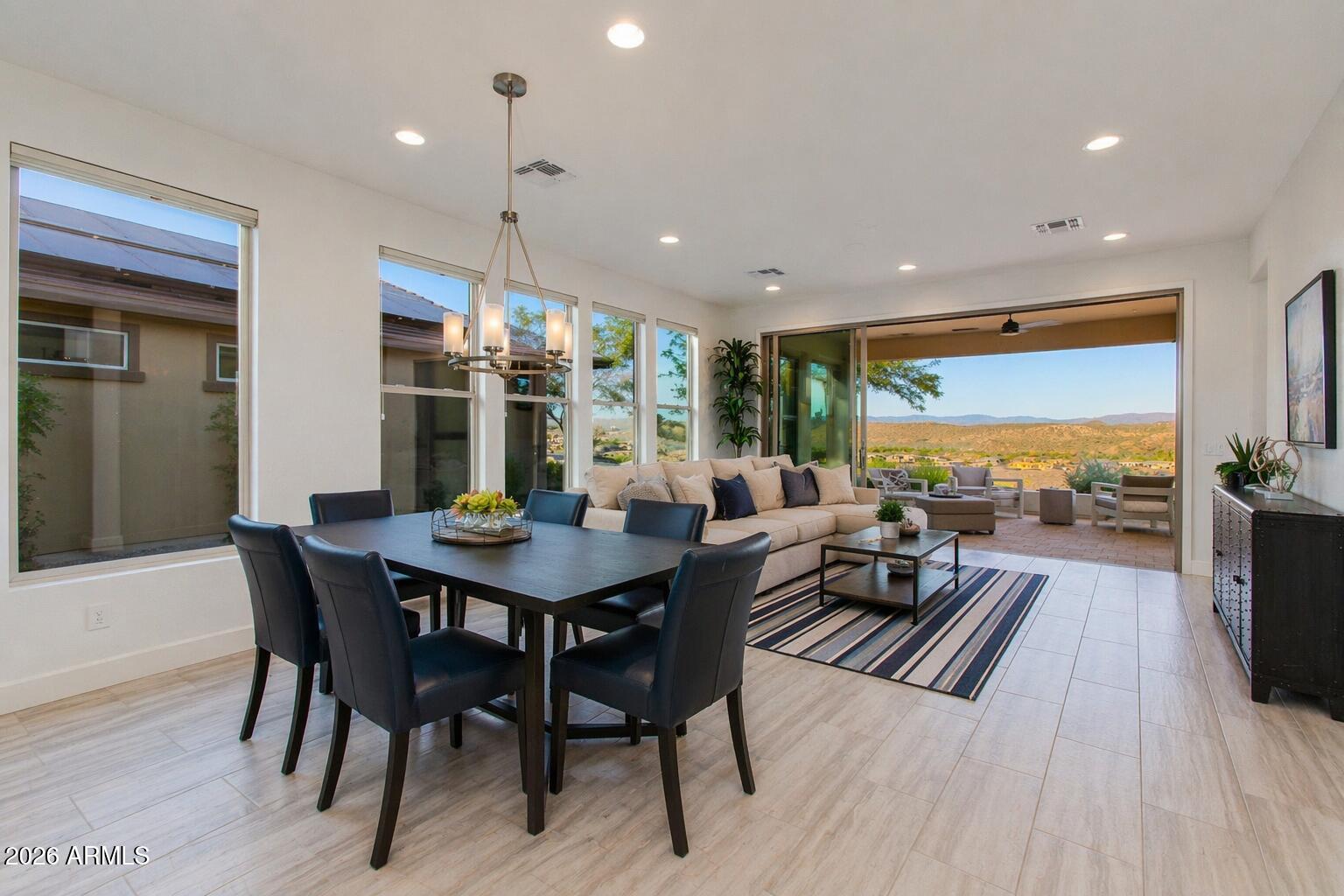 ENJOY SPECTACULAR EAST-FACING VIEWS w/stunning sunrise skies & soft desert color transitions at sunset from this Shea-built Beacon plan. Located just moments from walking trails & dog park, this 2 bed, 2 bath + den offers easy Lock-&-Leave living w/HOA-maintained front & backyard landscaping. Bright open layout w/large windows filling the home w/natural light. Kitchen features upgraded granite, stainless steel appliances & under-cabinet lighting. Tile flooring throughout main areas. Spacious backyard captures breathtaking desert mountain views--perfect for entertaining or quiet evenings. Primary suite offers en suite bath & walk-in closet. Enjoy resort-style amenities including golf, pools, fitness & trails.