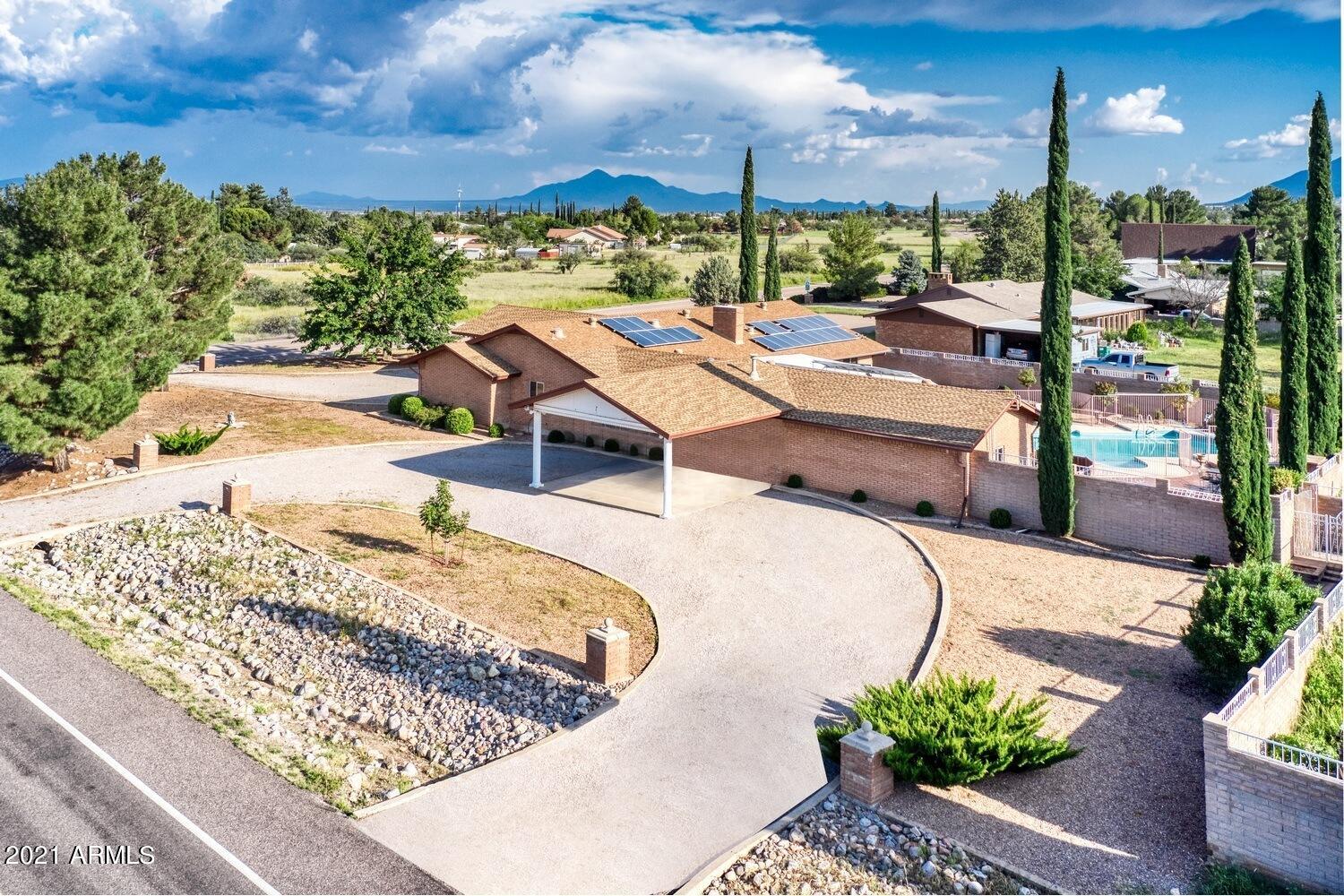 Totally remolded luxury 4000 sq. ft. home w/heated floors, on over an acre. Lg. open kitchen w/granite, upgraded appliances and cabinets w/matching built in hutch. 3 eat in areas to include elegant chandelier lighted formal dining rm., front formal rm. and  a cozy family room with fireplace. Primary bedroom with a must have walk in closet w/ built in drawers and shelves. his and her sinks and makeup vanity. 3 room guest quarters in north wing  with a full bath & Dbl. closet. Az. room w/custom crafted bar. Walk out onto fully coved patio perfect for entertaining in a Roman style swimming pool with stand free hot tub & outdoor BBQ area. . 3 car garage w/14x10 workshop.5x20 Storage shed  Circular drive way w/2 protocols. SSVEC Electric supplemented w/solar system.
