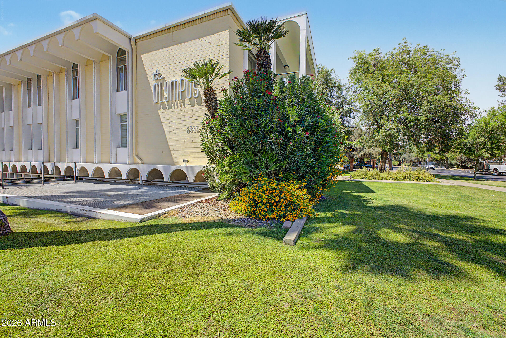 PRICE IMPROVEMENT! Exceptional value in one of Central Phoenix's most architecturally significant communities. HOA includes heating, cooling, hot water, cable television, high-speed internet, trash, sewer, exterior building maintenance, community pool, clubhouse, and common-area amenities.  Designed in 1964 by renowned architect Robert L. Starkovich and ideally positioned along Central Avenue and the Murphy Bridle Path, this iconic mid-century residence blends original walnut paneling, vintage vanities, and restored 1960s tilework with recent updates including new windows and sliding glass doors, refreshed baths with granite countertops and new plumbing fixtures, newer HVAC, and fresh interior paint. Expansive glass doors open to an oversized covered patio, while distinctive arches, fleur-de-lis breeze block, lush grounds, and underground parking complete this architecturally significant community.