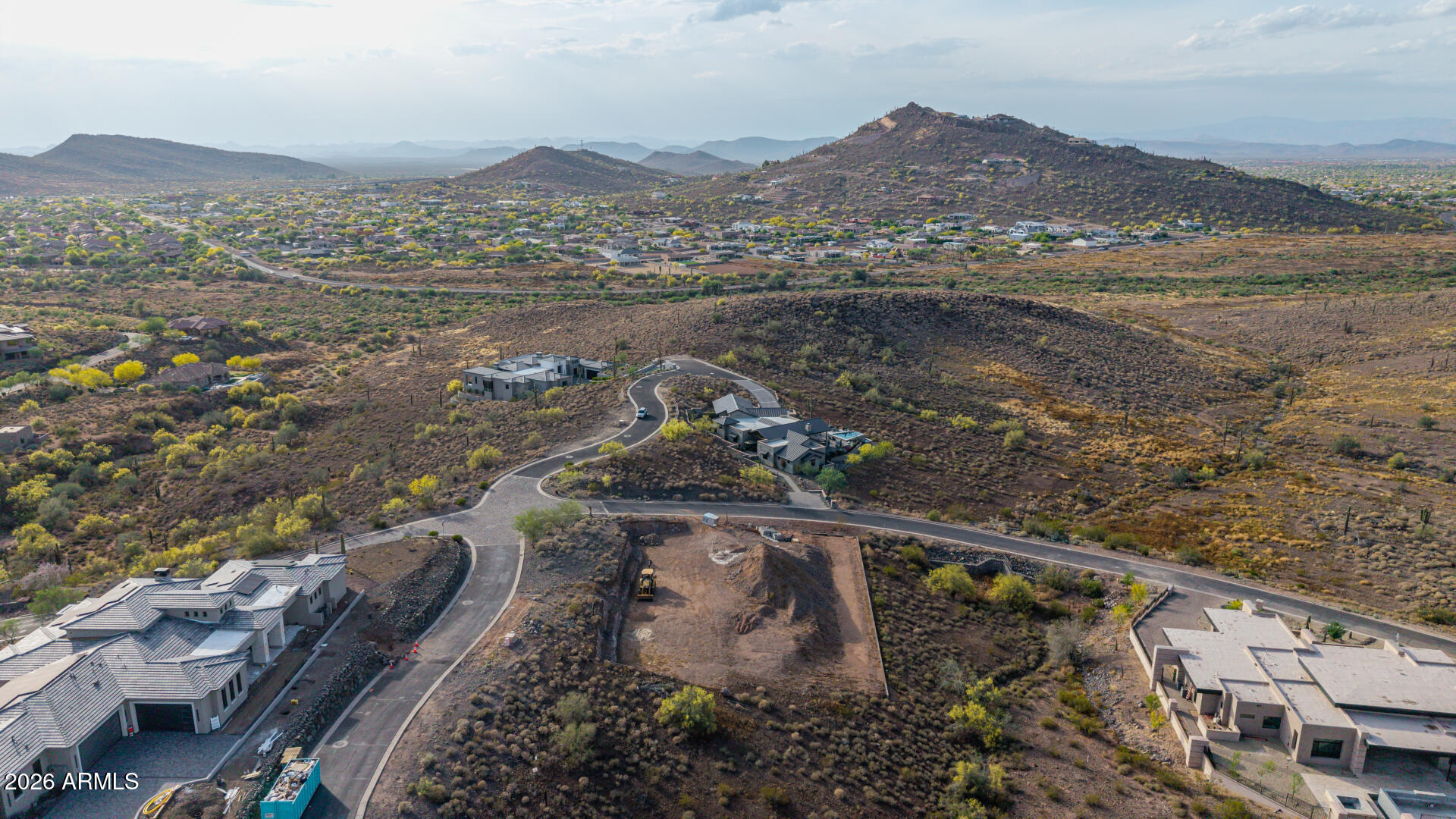 Exceptional 1.13-acre corner hillside lot in gated Ponticello at Tramonto with panoramic mountain and city-light views, offering a rare opportunity to build a luxury multi-level or walk-out custom home in one of North Phoenix's most desirable enclaves of high-end estates. Major development work is already complete, including excavation, hard dig, and retaining wall, with prior city hillside and building permits previously approved--saving valuable time, cost, and uncertainty. Seller's custom home plans and permits are included. All city utilities are on site: water, sewer, natural gas, and underground electric. Enjoy Tramonto amenities, Boulder Creek schools, nearby shopping, dining, and quick I-17 access. hillside lot offers exceptional design potential with panoramic mountain and city-light views, perfect for  a luxury multi-level or walk-out design. Located in a gated enclave of high-end custom homes, builders can deliver a standout finished product in a prestigious community with strong resale demand. *Enjoy access to Tramonto HOA amenities including pools, tennis courts, playgrounds, and walking trails, plus proximity to top-rated Boulder Creek schools, shopping, dining, and I-17 access. *All the groundwork is done - start building right away and bring your next showcase home to life.