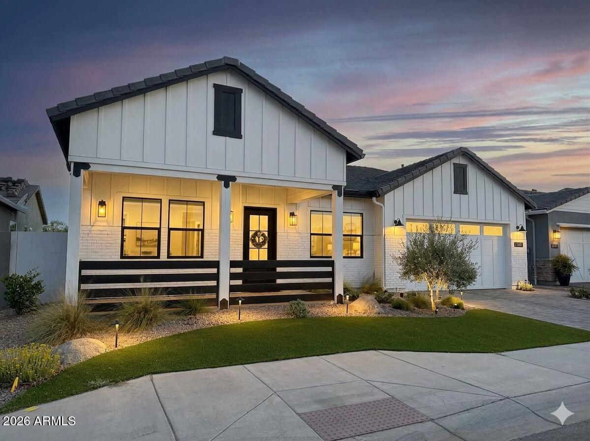 SOLD FURNISHED. On the golf course. Lake view. Mountain view. Sunset view. Packed with fine touches/design throughout and with a DEDICATED OFFICE. Experience luxury living in this stunning Skybrook model home, nestled within the exclusive 55+ section of the prestigious Sterling Grove Golf & Country Club. Boasting a charming White Farmhouse elevation, this residence perfectly blends classic elegance with modern sophisticated design.

Step inside to a grand living room featuring an elegant soffit ceiling accented by beautifully added beams. The chef's dream kitchen comes fully equipped with multiple premium ovens and a high-end Thermador refrigerator.

Outside, a private oasis awaits on the back patio. Entertain effortlessly with a built-in gas BBQ and gather around the natural gas... ... fire pit, all while soaking in a spectacular view. Features: Herringbone tiled entryway, solid core doors, kitchen cabinet LED trim lighting, garage cabinets/epoxy flooring.

Sterling Grove Golf & Country Club is the West Valley's newest golf experience. The Golf Course is a world-class Nicklaus Design course, operated by the renowned Troon Golf Management Services and designed to be enjoyed by golf enthusiasts and newcomers alike. The state-of-the-art practice facilities are second to none. Hone your skills at the driving range, putting and chipping greens, or in the golf simulator. This home has first-class amenities and beautiful views of the White Tank Mountains, lakes, and ponds. You'll also enjoy the neighborhood greenery on your walks, jogs, bike rides!