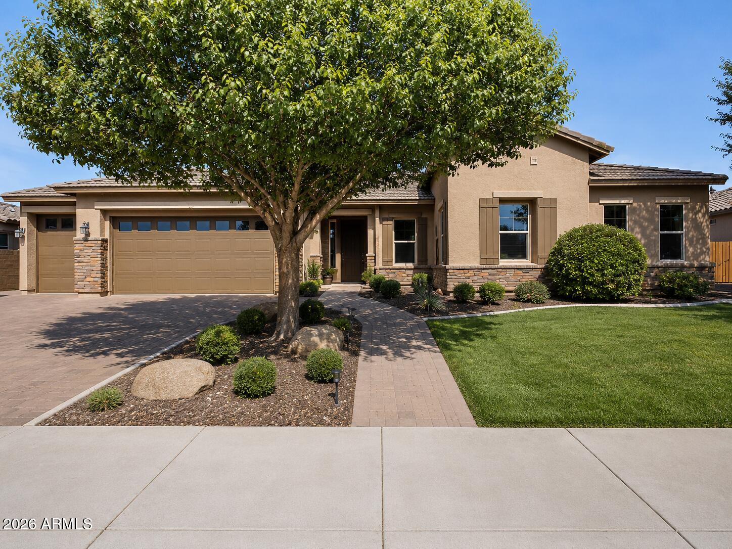 This beautiful Maplewood Court residence, features a paver driveway, RV gate, and 3-car garage with 1 stall designed for oversized vehicles. The home is one of the few in the area that backs up to a private road, offering unmatched privacy and quiet enjoyment.
Inside, wood plank tile flooring, plush carpeting, a formal dining room, den, and recessed lighting complement the living room's cozy fireplace. The kitchen offers abundant cabinetry, granite countertops, stainless steel appliances, tile backsplash, and a large island with breakfast bar. A media room with a built-in screen and sound system adds a dedicated space for entertainment.
The primary suite includes a custom walk-in closet. An additional bedroom with its own private ensuite suits multi-generational living There is a central vacuum system with 2 inlets throughout this expansive single-level layout, whole-home convenience with commercial-grade suction and exterior exhaust for cleaner indoor air. Outside, enjoy a backyard oasis with an extended covered patio, a fire pit, grassy areas, a sparkling pool with removable fence, and spa.
Just steps from the community park and minutes from Chandler's restaurants, markets, medical centers, and vibrant downtown. Schedule your private tour today, homes like this don't last.