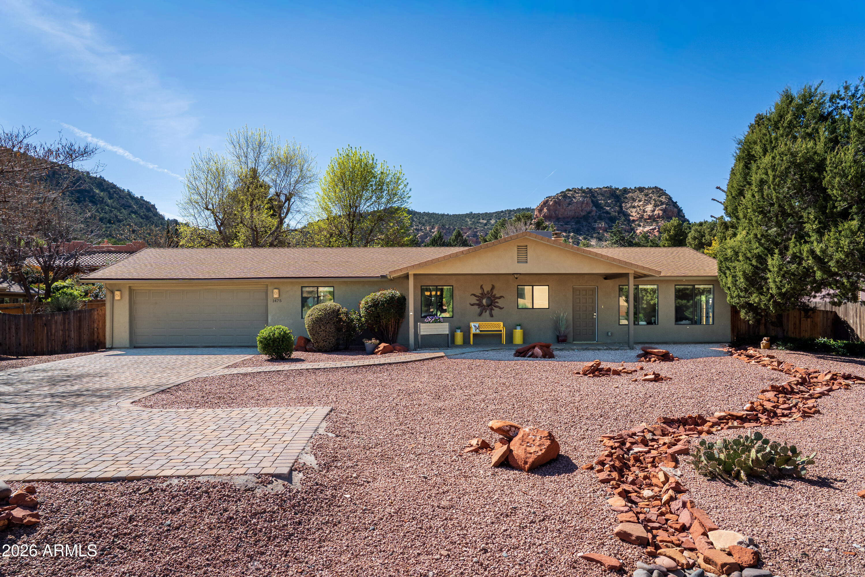 STR ALLOWABLE  - It's time to start living your Sedona dream...step into your next adventure in this beautifully updated home with 3 spacious bedrooms and 2 full baths, all on a single level located in the heart of the Village of Oak Creek. Extensively remodeled in 2018, this 1765 sq. ft. residence offers the perfect blend of modern comfort and rugged Arizona beauty with a fully fenced backyard.  Imagine starting your morning with coffee on the front paver patio, surrounded by gorgeous mountain views, before heading out to the world-class hiking and biking trails just minutes from your front door. With three golf courses nearby and serene Oak Creek and Red Rock Crossing a short drive away, this home is a gateway to the best of Northern Arizona.