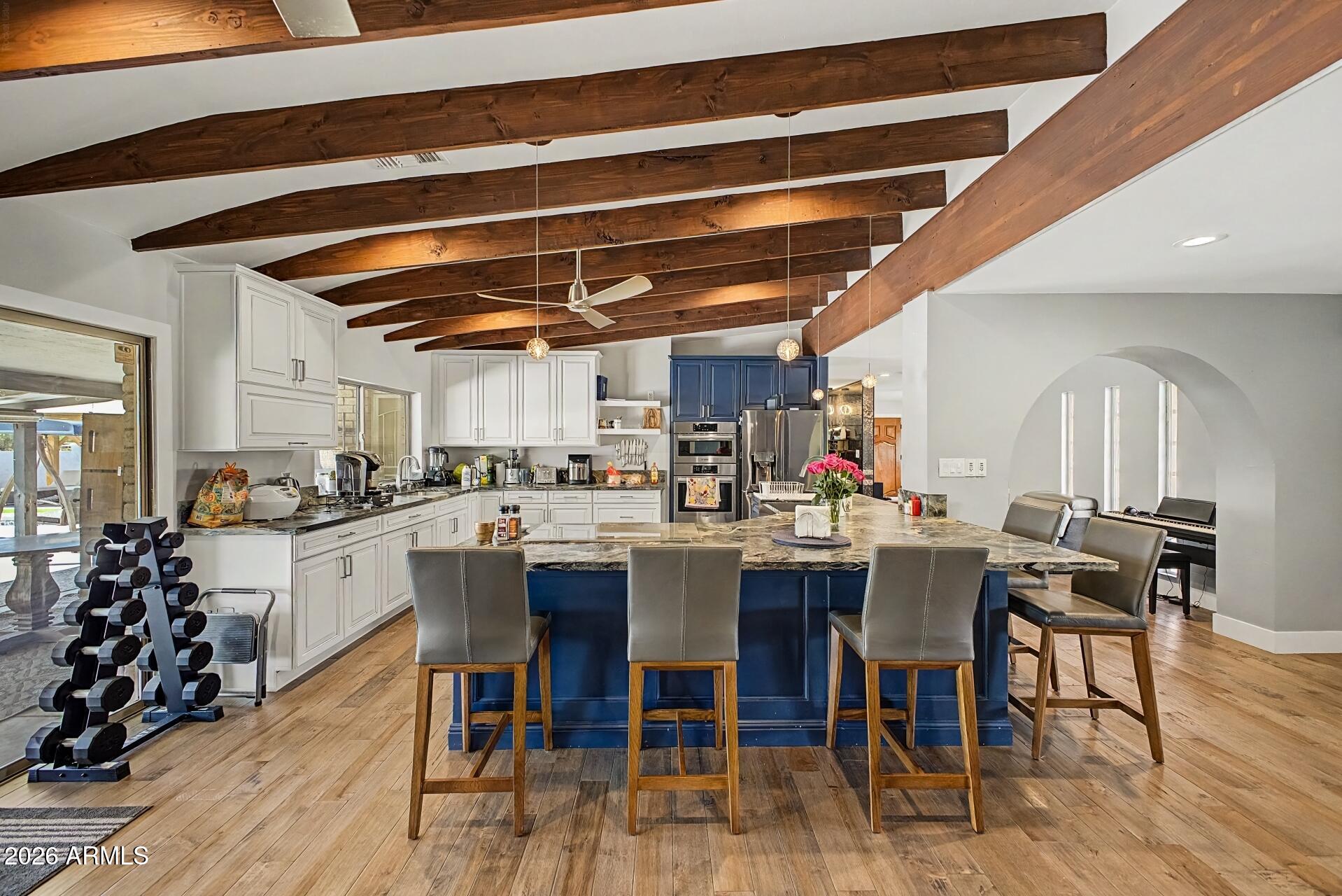 Over $250,000 in recent renovations have transformed this Moon Valley Country Club home, with just a few items remaining to make it shine. After Renovation Value (ARV) up to $1.1M, the opportunity is clear. The stunning kitchen features raised ceilings, wood beams, white and navy cabinetry, leathered granite countertops, Bosch and LG appliances, an induction cooktop, stainless farmhouse sink, new electrical and plumbing, newer HVAC, and more. Additional updates include wood flooring, thoughtful designer finishes, a remodeled primary bath with a stand-alone soaking tub and separate shower, and remodeled secondary bathrooms. Outdoor living includes two gazebos, turf, hardscaping, and a pool/spa ready for some TLC. A beautiful home with major improvements already completed. NO HOA