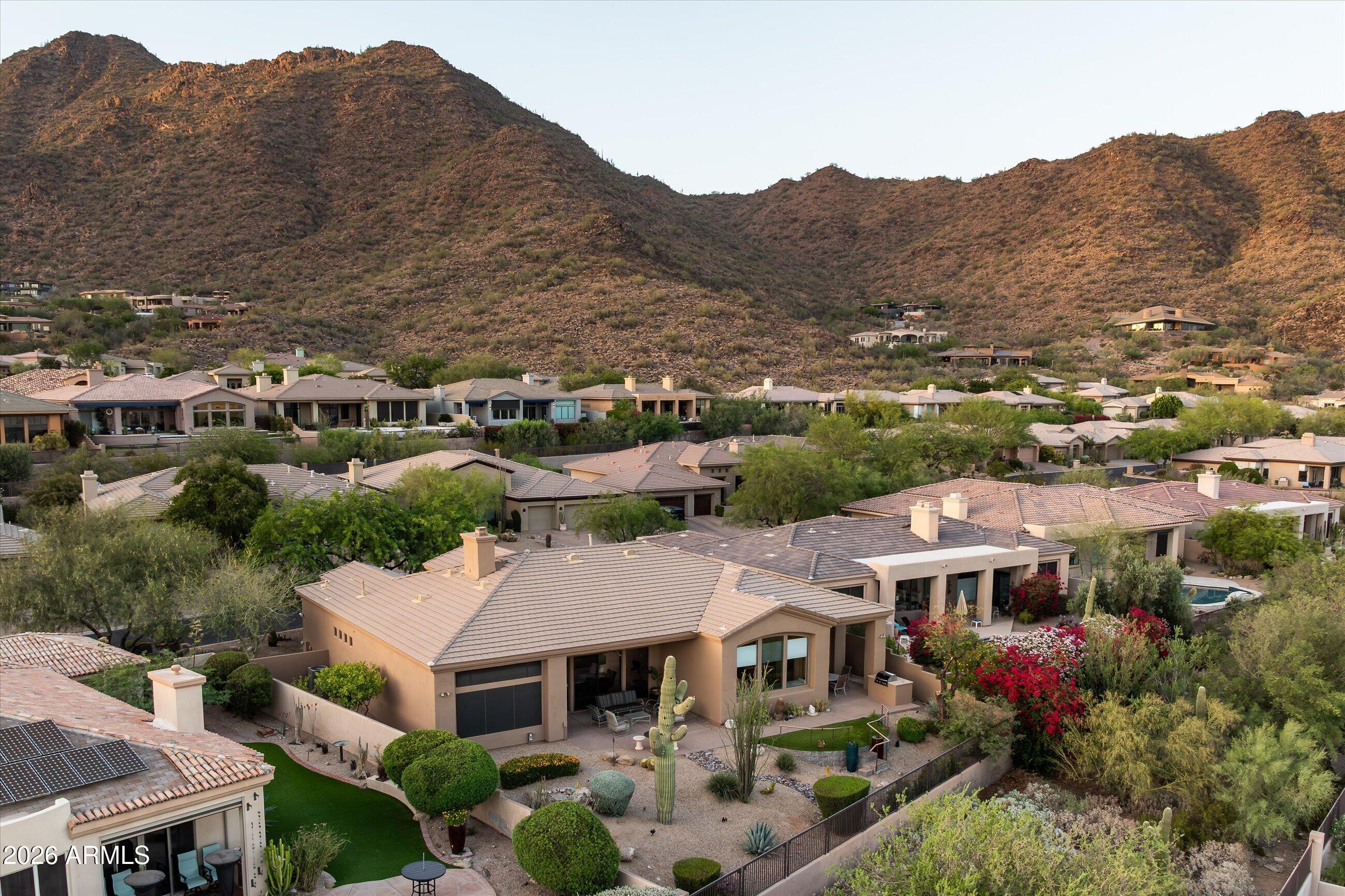 Experience elevated Scottsdale living in this updated home featuring no steps & big views in a premier guard gated community. Thoughtfully refreshed throughout, this property offers an open floor plan, remodeled bathrooms, new countertops throughout, a new roof, & two newer HVAC units. Expansive windows fill the home with natural light while showcasing the mountain views. The spacious primary suite is a true retreat featuring a separate his and hers water closets & generous walk-in closets. Enjoy outdoor living with two entertaining spaces, a built-in BBQ, and mature desert landscaping. Community amenities include: spa, tennis & pickleball courts, plus easy access to popular McDowell Sonoran Preserve hiking trails. Excellent Location - near Mayo Hospital & Basis Charter Schools.