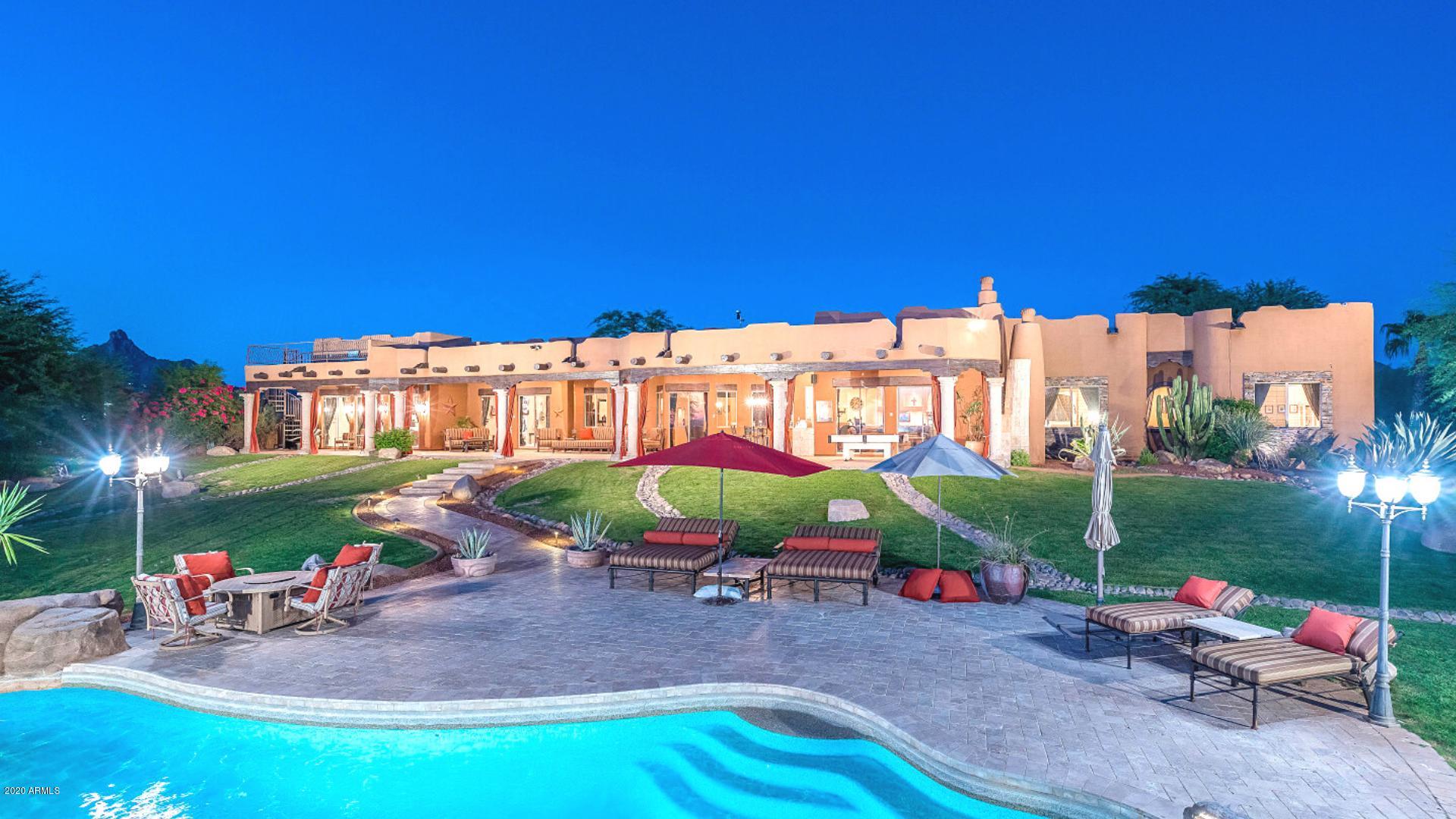This is a Cabo Style resort home with all the privacy you could want in the center of Scottsdale. A comfortable sprawling playground with always something to do. The home and guest house are a combined 7,400 square feet with rooms to retire and rooms to rock. Sand volleyball, Basketball, large pool with slide and your own private dirt bike trail. Generous rooms all with their own bathrooms. As you walk in the door you feel at home. The opportunity to buy it fully furnished makes it even easier to move in. Comfort, convenient and a wonderful place to be. If walls could talk this home would be singing .  A territorial masterpiece. Warm, inviting and a home that you want to live inside and live outside at the same time