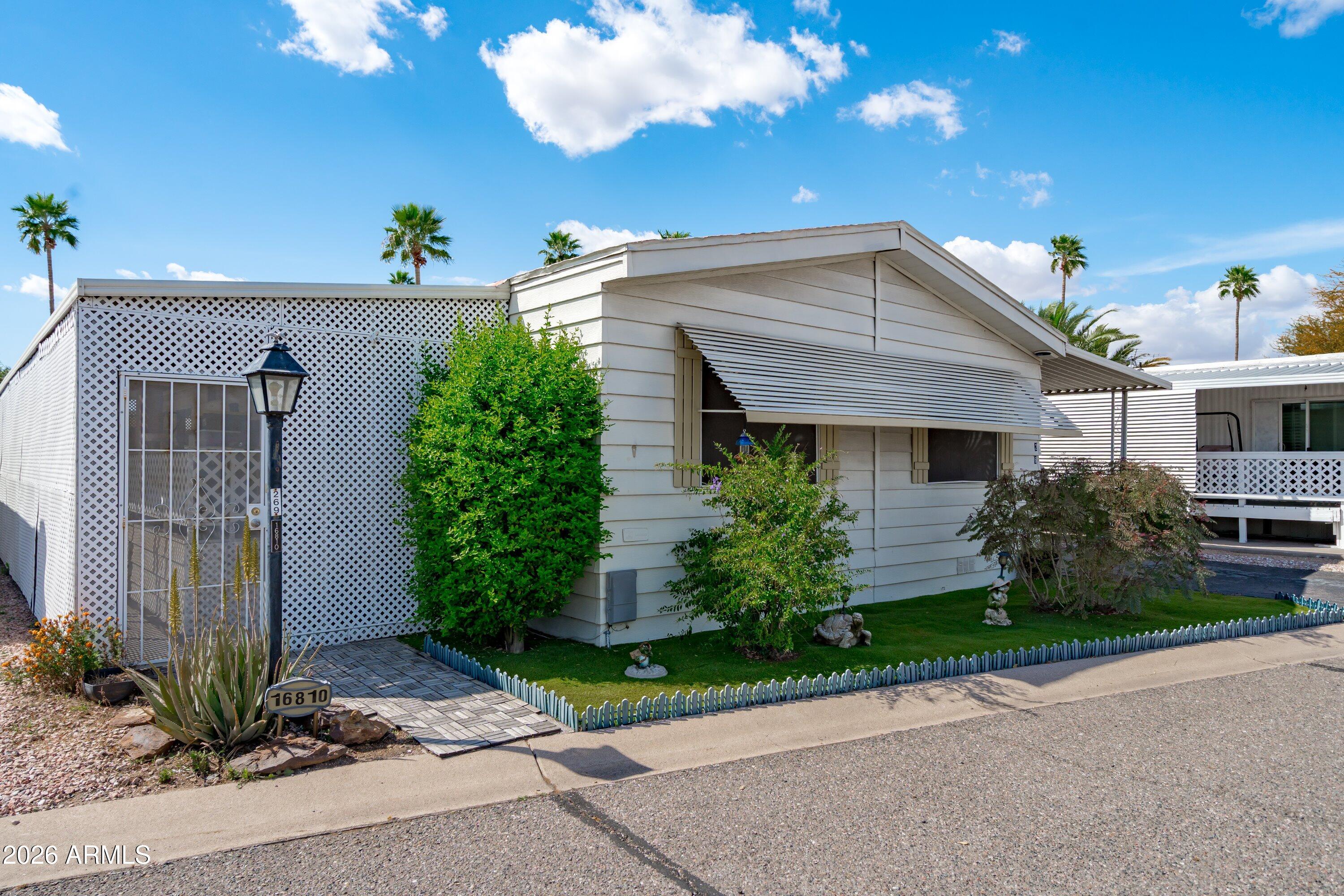 Charming 3 bedroom, 2 bath mobile home in a highly desirable location close to popular dining and convenient shopping. Nestled within a welcoming adult community, residents enjoy fantastic amenities including a refreshing pool, golf, shuffleboard, and a vibrant clubhouse. The property also features a fenced yard area, perfect for relaxing or entertaining, and a separate workshop with power, ideal for hobbies or extra storage. A wonderful opportunity to enjoy comfort, convenience, and an active lifestyle all in one place.