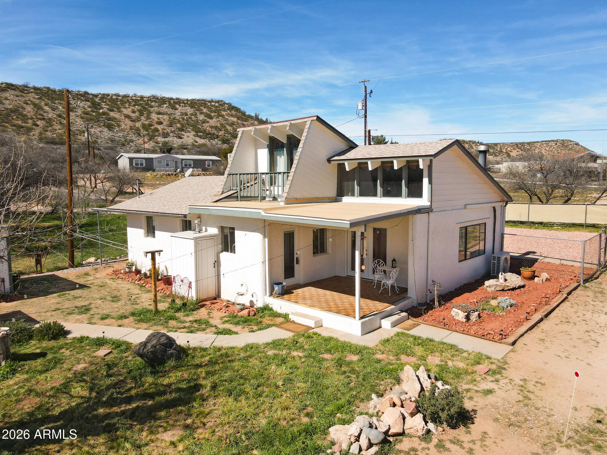 Beautiful cottage with detached casita on appx an acre in picturesque Cornville.  Close to the park and some of the best restaurants the Verde Valley has to offer.  Bring your horses to this fully fenced property with additional cut fencing and dog yard.  Masterfully renovated with new roofs, some new tile and laminate flooring, water pressure tank, hot water tank and landscaping with fruit trees.  Upgraded cast iron tub, trim, drainage, septic drain, electric and plumbing .  Newer washer, dryer and refrigerators still under warranty.  This property is on a private well.  Convenient location for primary residence or rental property.