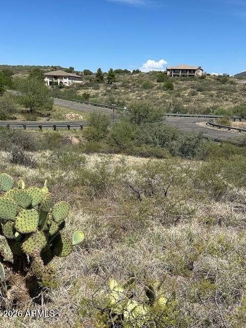Tucked away in the quiet, gated community of Daybreak at Bensch Ranch, this private homesite offers sweeping views of the surrounding high desert hills and distant mountain ridgelines. Set on a peaceful lot with minimal neighboring development, it's the ideal place to build a custom home designed to take full advantage of the natural scenery and tranquil setting. At over 4,000 feet in elevation, you'll enjoy refreshing breezes, star-filled skies, and four mild seasons--all just far enough from the city to feel secluded, yet close enough for convenience. Bensch Ranch offers paved roads, a private water and sewer system, electricity, optional propane, and access to a well-equipped clubhouse, fitness center, pool, and spa. Just minutes from I-17.