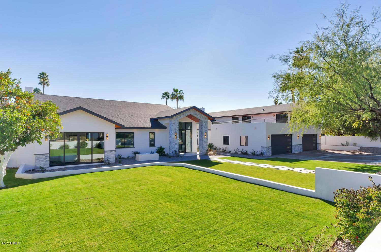 Incredible value in Arcadia with price enhancement.  Fabulous new contemporary home in the heart of Arcadia. The main house built in 1964 is now a complete new build in 2016. Come see the home that has two beautiful kitchens. The main house has state of the art kitchen appliances which include the newest Wolf Induction cook top, two dishwashers, microwave and Sub Zero refrigerator. Your guest will enjoy their own private quarters with newly renovated kitchen,family room, dining room and private balcony. Enjoy the pickle ball court and private pool while entertaining your guest with a fabulous BBQ . The home has dead on views of Camelback & Papago Mt. The large grassy yards with two outdoor fireplaces speaks to the perfect Arcadia experience.