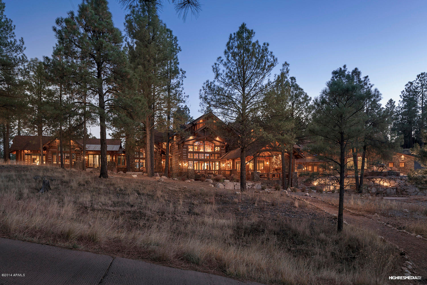 One of the most incredible opportunities to own a one-of-a-kind luxury mountain retreat in the award winning golf community of Pine Canyon has just arrived. This magnificent residence boasts almost 12,000 square feet of space including a professionally designed main residence and an entertainment pavilion with a private home theater. Custom interior features include reclaimed wood flooring from the 1800’s shipped from Lynchburg, TN, hand textured wall treatments, incredible stonework, walls of hand hewn chinked logs and rustic timbers. The main level offers an impressive entry that opens to the great room with life-size stone fireplace and a wall of retractable Nana doors to the outdoor verandas. The dream kitchen has a center island and a wrap around bar with copper sinks. One of the most incredible opportunities to own a one-of-a-kind luxury mountain retreat in the award winning golf community of Pine Canyon has just arrived. This magnificent residence boasts almost 12,000 square feet of space including a professionally designed main residence and an entertainment pavilion with a private home theater. Custom interior features include reclaimed wood flooring from the 1800's shipped from Lynchburg, IN, hand textured wall treatments, incredible stonework, walls of hand hewn chinked logs and rustic timbers. 

The main level offers an impressive entry that opens to the great room with life-size stone fireplace and a wall of retractable Nana doors to the outdoor verandas. The dream kitchen has a center island and a wrap around bar with copper sinks and oil rubbed bronze fixtures that play off the fully loaded stainless appliance package with Wolf range/ovens, side by side Sub-Zero refrigerators, two Asko dishwashers and so many extras. The formal dining room offers dramatic ceilings and windows that look out toward a private creek and the golf course beyond and is adjacent to the butlers pantry with wet bar and 300+ bottle wine cellar. 

A dreamy getaway, the master suite is nothing short of impressive with a private sitting area warmed by a large stone fireplace and wet bar, an inviting bedroom with custom blackout draperies and a rustic bath with large steam shower with every bell and whistle, a magnificent granite soaking tub made out of one solid slab, dual vanities and a spacious walk-in closet. The walk-in pantry is designed with a chef's desk, a 2nd commercial side by side Frigidaire refrigerator and plenty of storage. The first guest suite/office is a gorgeous setting with a private bath of slate and copper and a walk-in closet. The laundry room is equipped with an island, ample storage and space for dual stackable washers and dryers.

A dramatic set of rustic industrial designed stairs lead to the second level with three spacious yet cozy guest suites â€" two of which have private baths and large walk-in closets and the other a private bath, walk-in closet and fireplace. It also is home to a wet bar area with refrigerator and microwave, a powder bath and an extra large entertainment room anchored by a grand stone fireplace with space for pool/ping pong, gaming, and a media area with handcrafted cabinetry. 

The entertainment pavilion offers a second level fully equipped private home theater, a powder bath, workshop and a flexible heated barn space can accommodate 10-12 cars, a play area, indoor tennis, or additional gaming area. It is designed with the finest finishes and barn doors from an old horse barn in Kentucky to impress your even your most discerning guests.