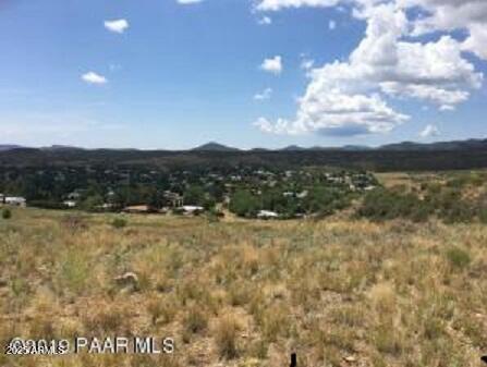 Stunning 360 view lot in the best area of the Prescott Country Club. This lot goes down into a valley so no homes can be built behind. The utilities are at the street; electric ,city water, and sewer. This is a dream lot to build your dream home. Additionally this lot in the country club has no HOA fees