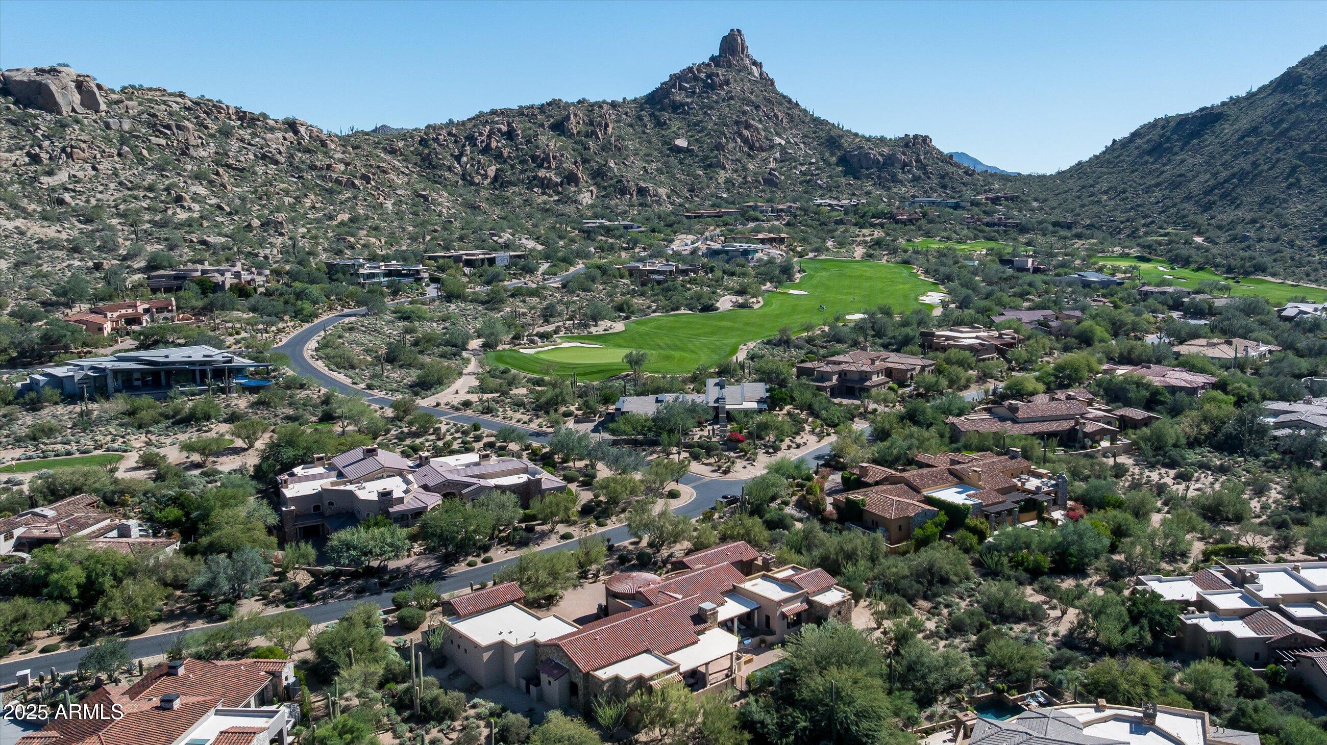Welcome to luxury living at the Cuvée House located in the guard-gated community of Estancia at the base of Pinnacle Peak.  The property offers a perfect blend of entertaining and family living spaces and includes a rare double-kitchen concept for culinary adventures.  The floor plan includes a spacious living room with formal dining, a family room with 2 seating areas, 4 large suites and multiple outdoor relaxation and dining areas. Interior materials include stone tile and walnut plank flooring, alderwood doors and cabinetry and an abundance of wood-framed windows providing natural light. The open, functional floor plan blends elegance with comfort with seamless indoor-outdoor flow highlighted by a heated pool, built-in BBQ station and The Plaza, an outdoor living room with a gas fireplace. The exterior details include dry-stacked stone, stucco and natural wood-trimmed elements. The extended length 3-car garage provides ample space for vehicles and storage.