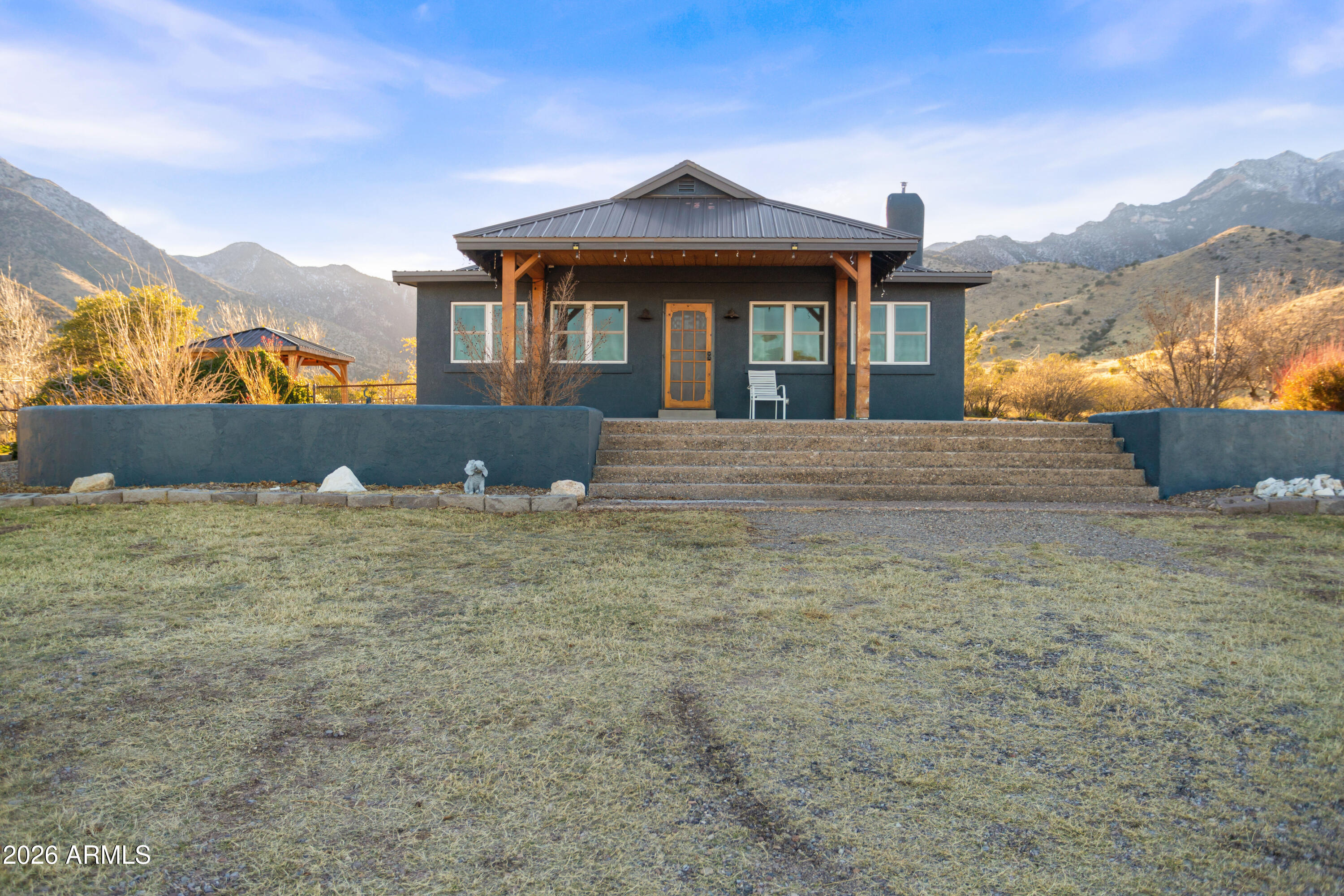 Come home from the hustle and bustle to your very own private retreat. Nestled at the bottom of the mountain with just shy of 4 acres. Nothing but the best views out of every corner of this remodeled 4 bed 2.5 bath home. The kitchen is a dream with Thermadore appliances and abundant storage. Enjoy the beautiful pellet stove to peacefully warm the great room. The large patios offer space for you to enjoy the views while relaxing outside, just a little ways down some steps you can even appreciate the stream running through the property. All of this brings wildlife, perfect for any nature lover.  Don't miss out on this rare opportunity to make an oasis home.