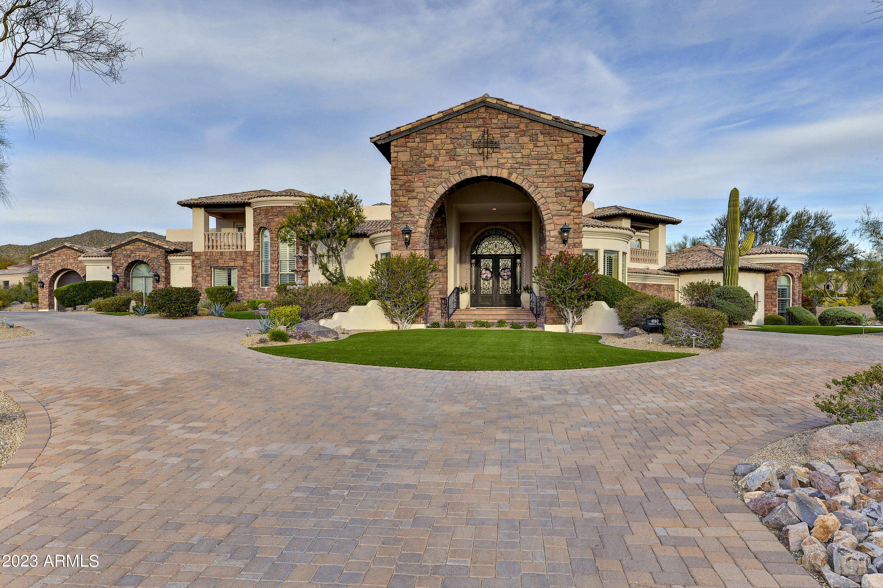 This WORLD CLASS ATHLETE'S HOME sits adjacent the Las Sendas Mtn. Golf Course in N.E. Mesa! This home boasts 7,919 SF. Total w/Casita. 1.83 acres at the end of cul-de-sac is incredibly private! Award winning designed space & MAIN FLOOR LIVING!*Butted Glass windows & doors view the tropical 5-Star resort-like grounds from kitchen/great room w/soaring ceilings*Walk out to over 2,200 s.f. of Covered Patio for entertaining!*Tee off from your own 5-hole golf course w/1,881 s.f. Jack Nicklaus Putting Green & 5 tees! Heated Pool(w/2 swim jets)& spa, Chef's kitchen boast 36'' and 48'' refrigerators 2 dishwashers, Gas Range, Miele Steam oven, warming drawer & huge 8 person sit-up bar. Extra deep 4 car-garage extra deep & 
2 car garage in Casita w/Golf Simulato *2 covered patio decks*Ceiling details include groin vaults and modern designs*Cantera stone hand-carved columns at entry and cantera fireplace*Enter home to a great room, kitchen, 2 offices, 1/2 bath, master bed/bath, Laundry room, Formal Dining, & 4-car garage without any steps! Amazing storage rooms to die for!*Master suite has sitting area and fire place*Master bath showcases marble counters, his/her sinks, exceptional jetted tub w/mood lights*Steam shower w/body jets, & numerous other fixtures*Two large walk-in closets for his/her w/additional massive storage room or SAFE ROOM!*Drop down 7 stairs on Opposite side of home to 3 naturally cooled bedrooms all w/huge walk-in closets*2 full baths (one with jetted tub) and an additional bedroom currently used for a 3rd office w/built in cabinetry*Amazing game room/media room w/fireplace to take up a game of pool or watch your favorite movie all at the same time!*Wet bar has GE Monogram Wine refrigerator*Upstairs 5th En-suite bedroom also offers 2 private balconies for the prince or princess with expansive city light views to west or Mtn./golf course views to the east!*Off great room,follow the covered breezeway to the fully contained 1 bedroom/bath Gen X/Mother-in-law or guest house*Full kitchenette,w/microwave/frig/Ice Maker & full size laundry, Exercise Room + 4 person sauna!*Finish off this area with a 2-car garage or keep it as an indoor golf driving range (or batting cage) currently used by a professional golfer*This is a MUST SEE as there are too many amenities to mention*Meticulously maintained* must see HOME UPDATES LIST in Documents tab. Las Sendas is a premier master planned community offering healthy lifestyle opportunities, multi-generational activities and superior services to homeowners in a comfortable, beautifully-maintained desert environment with scenic mountain and valley views.