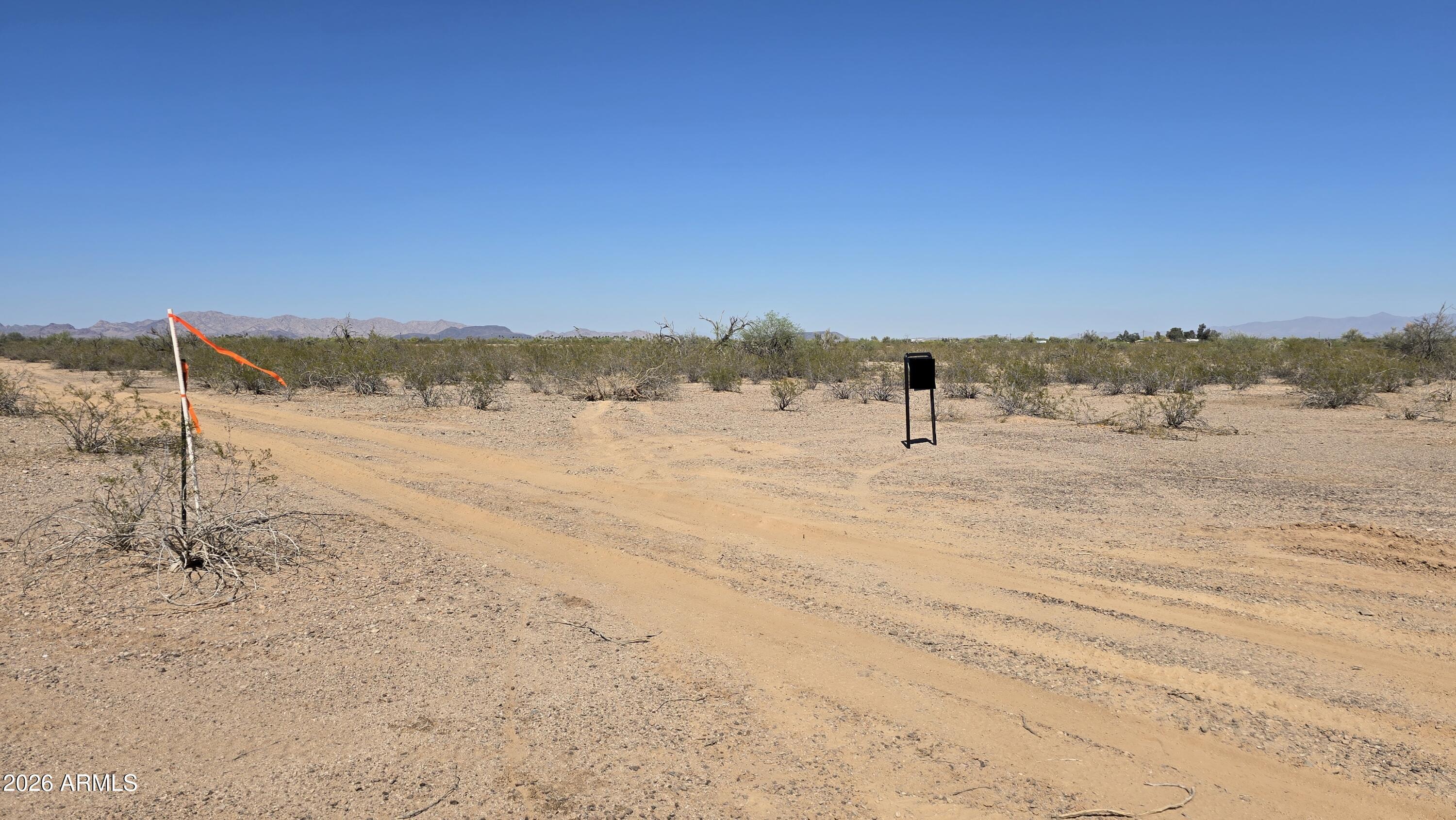 Rare 20-acre R-43 zoned parcel in the Saddle Mountain Ranch area featuring expansive desert and mountain views with flexible residential & rural use. Seller financing available. Power is in the area, check with APS for availability and connection details. Ideal for a custom home, manufactured home, ranch setup, or long-term land hold. Potential for future lot split or rezone to commercial. Seller owns 10 additional acres abutting & 5 acre parcels nearby. Near Hickman's Egg Farm and the beautiful new Saddle Mountain RV Park. Less than 2 miles to the 411th Ave. off ramp!  Parcel is located in partial floodplain, do your homework to see it is a buildable zone. Enjoy privacy, wide-open space, and a peaceful rural setting with strong long-term growth potential. Plan to come see this one today!