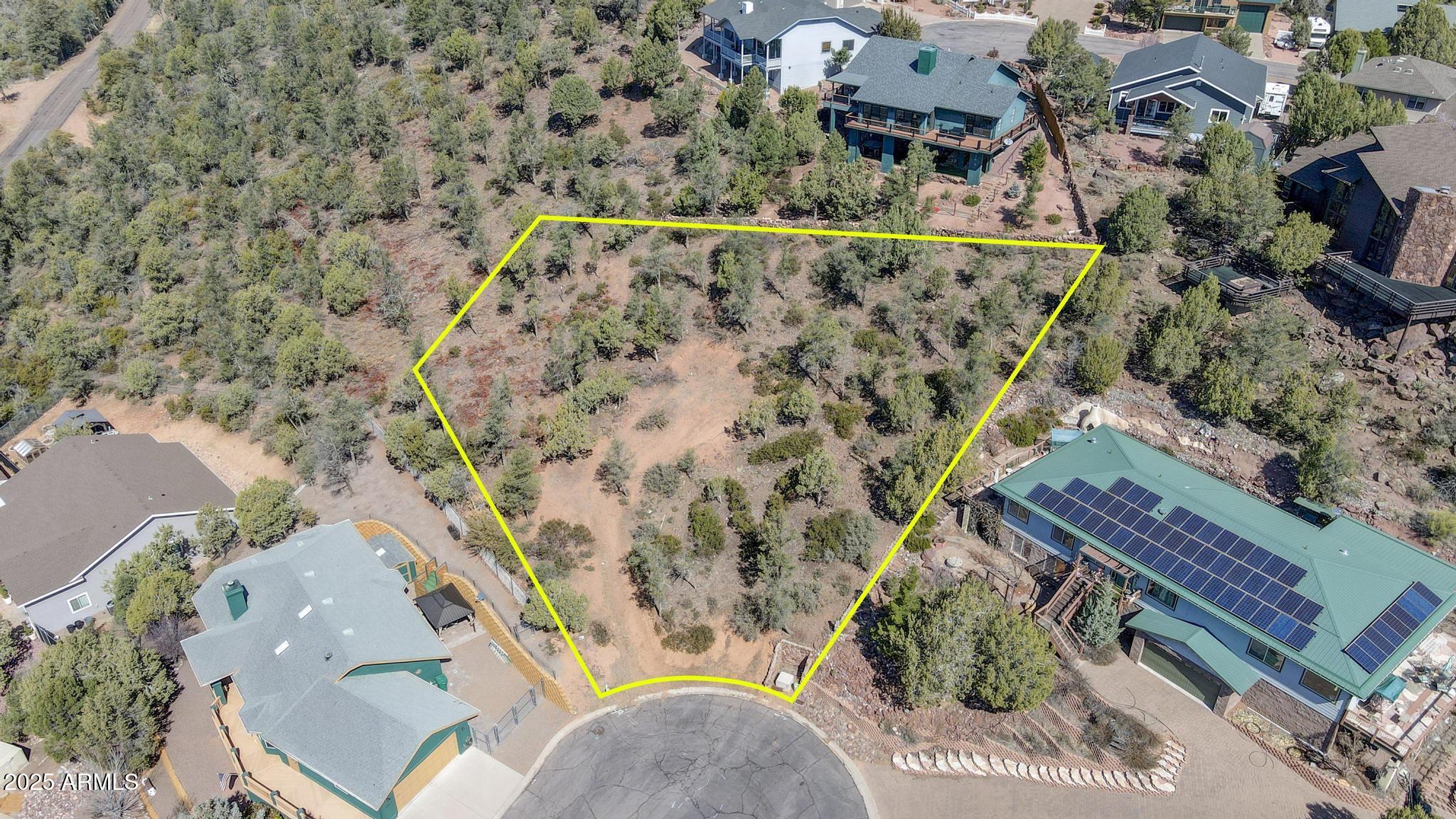 Nestled in the highly desirable Wildwood subdivision on Payson's west side, this incredible over half acre view lot offers breathtaking, unobstructed 180-degree vistas to the east, west and south. Positioned at the top of a cul-de-sac, the sloped lot features an area that is flat for a perfect building envelope, making it an ideal site for your dream home. The lot has been professionally selectively cleared to make it a firewise safer property, and while the frontage includes a steep grade, skilled local contractors can craft a driveway with ease. Wildwood is one of the most sought-after communities, located just above the Payson Golf Course.   To the west, the landscape transitions into pristine national forest, ensuring long-term privacy and a natural backdrop. Conveniently located less than a mile from Green Valley Park, you'll enjoy year-round events such as concerts, fishing tournaments, car shows, and spectacular 4th of July fireworks, all hosted by the Payson Parks and Recreation Department. Additionally, within five minutes, you'll find easy access to national forest trails for off-road vehicleswithout the congestion of town traffic. Come walk this remarkable lot and envision your future home, where you'll wake up to awe-inspiring views every day!