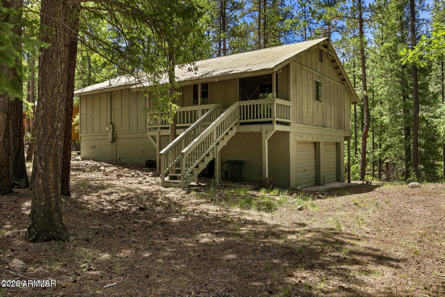 White Mountain country cabin tucked among the pines in the beautiful Tal-WiWi subdivision! This charming 1,161 sq. ft. cabin backs directly to National Forest and sits on 0.43 acres near the back of the subdivision, offering privacy, mature pines, and a peaceful mountain setting. Featuring 3 bedrooms, 2 bathrooms, a 2-car garage, and a basement, this property is full of potential. The front and back decks have been updated, creating inviting spaces to relax and enjoy the cool mountain air. Inside, the cabin offers a cozy propane fireplace and is turnkey, move-in ready, and perfect as a summer getaway, full-time retreat, or mountain escape. The unfinished basement offers endless possibilities and could be finished for additional living space, guest quarters, a game room, or storage. Tal-WiWi POA includes community water sourced by an underground spring, and the subdivision is also home to Shadow's Restaurant for convenient nearby dining.
Alpine is known for world-class hunting and fishing, hiking and biking trails, lakes, streams, wildlife, and small-town mountain charm. Sunrise Ski Resort is approximately 40 minutes away, offering year-round recreation and entertainment. Escape the heat and come enjoy nature, tall pines, and all the beauty the White Mountains have to offer!