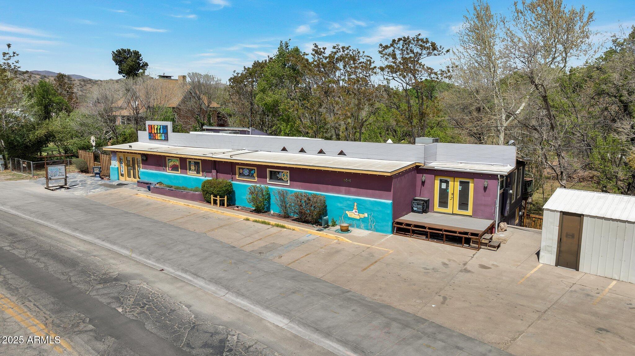 Have you been dreaming of the perfect investment in Old Town Cottonwood? Here's your chance! Not only is it located right on N Main St, it backs right up to the Cottonwood Ditch, perfect for a natural habit to enjoy. Currently being used as the well-established Hippy Emporium, but zoned C-1, which opens up other business options with four different areas upstairs, an apartment and living quarters downstairs for the shopkeeper, the possibilities are endless. By the way, it has it's own parking lot out front too. Don't wait! Now is the time to make your Arizona Dreams Come True! Please DON'T bother the customers or business owner/employees. Agent accompany showings.