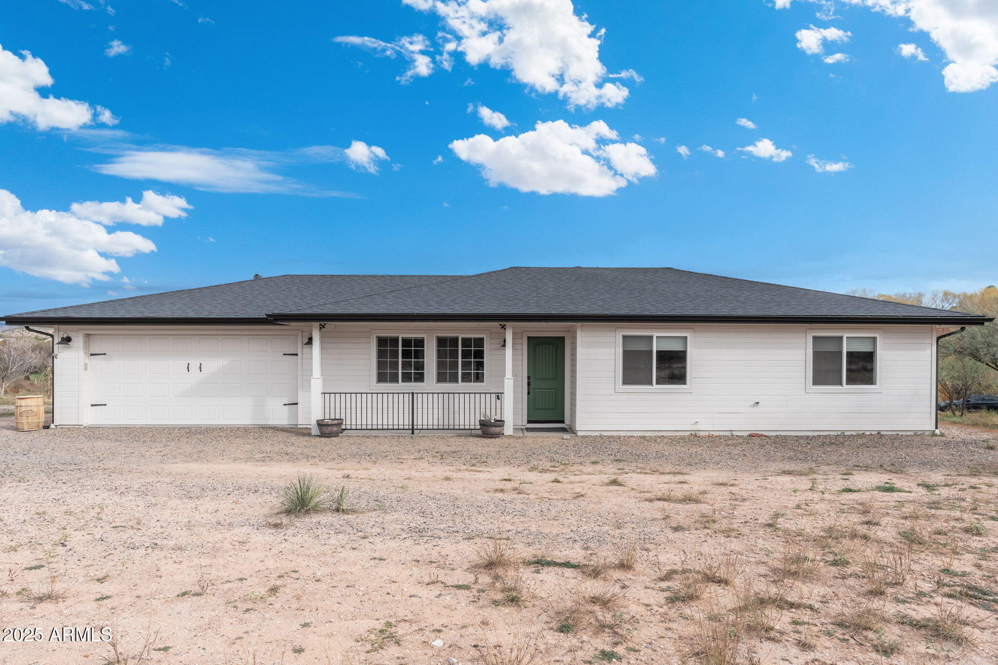 MUST SEE!!!Rare opportunity to own a home on 7 acres with over 400 feet of Oak Creek frontage, Grandfathered irrigation rights and bordering Coconino National Forest.  
Quality Energy Star home built in 2022 with 3 bedrooms, 2 bathrooms, upgraded kitchen and 2 car garage w storage room. Oversized septic and electric panel for home expansion or guest home. Auto irrigated fruit and Black Walnut trees, garden and grass area.  Rainwater collection tank as well as partial plumbing for creek irrigation.  Vast options for farming, Vineyard, or serene private ranch.  Zoned for horses and livestock. 
Views of Mingus Mountain and red rocks. Nice beach area with easy drop in for kayaks, fishing and swimming. 10x20 shed and 10x12 air conditioned building with sink, fridge, cabinets, and stove. Perfect for greenhouse use and party prep.  Water and double electric hook up for RV. This is a truly magical place among the large Sycamore, Cottonwood and Willow trees.  No HOA.