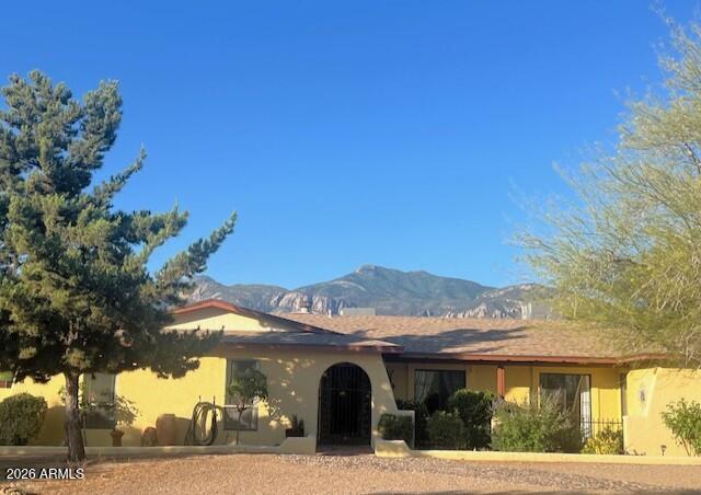 Amazing home in prestigious Huachuca Mountain Village! Nestled on a quiet street, this spacious 2,603-square-foot residence offers everything you need to enjoy comfortable living. The thoughtfully designed floor plan features a dedicated media room with special lighting, a library/sitting room, a separate office & generous living spaces throughout.
The home has been updated with newer kitchen appliances, two HVAC systems, upgraded flooring, and security front and office doors. The hall bathroom features a newly installed walk-in shower for added convenience. Outside, you'll find a 2.5-car garage, two Conex storage containers offering abundant storage or workshop potential, and a built-in BBQ perfect for entertaining family and friends. Enjoy the spacious interior & peaceful mountain views