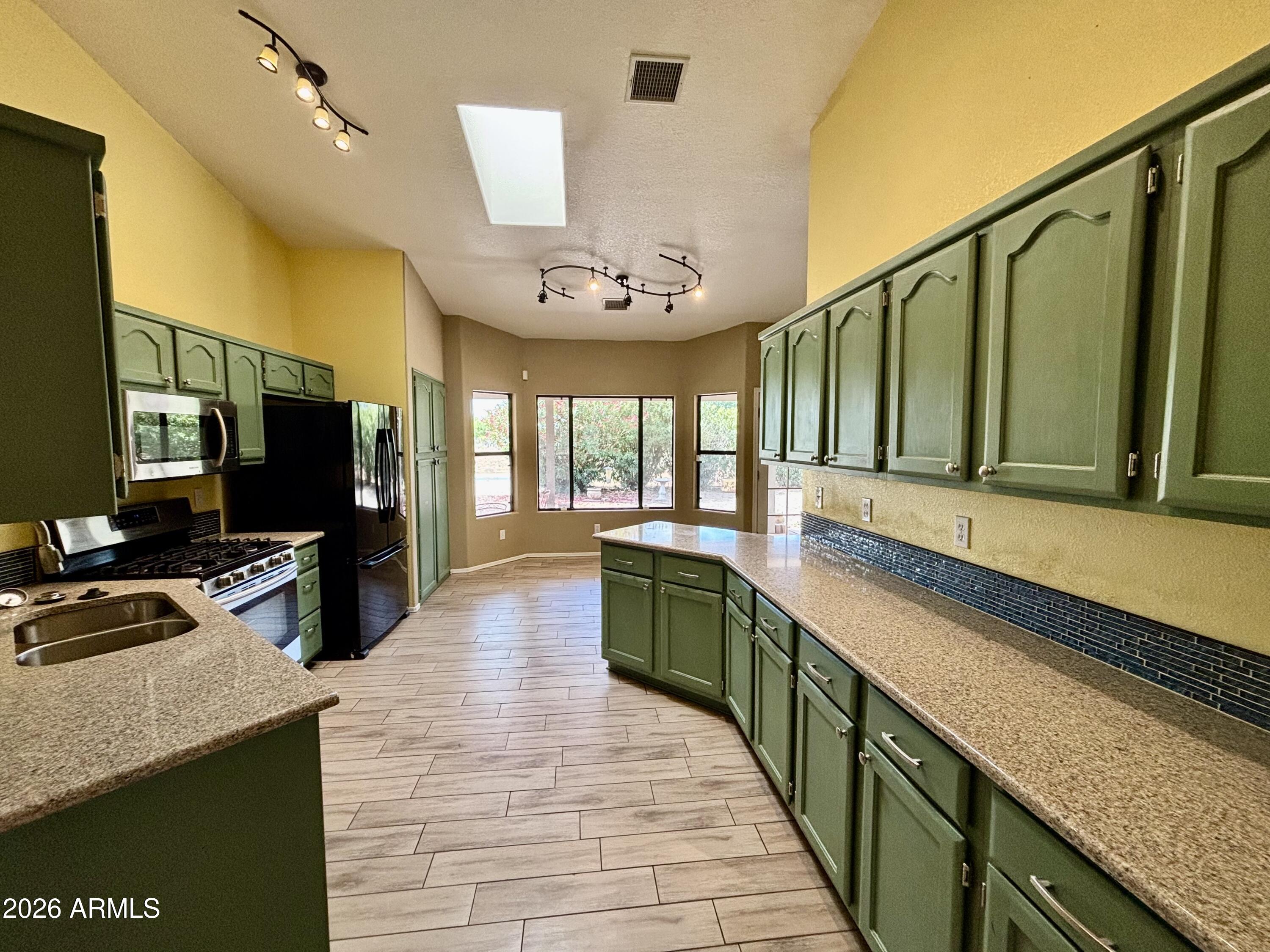 Desirable Mountain Shadows subdivision.  Three bedroom with den. Situated on a fully fenced lot just under one acre, this property offers beautiful mountain views, privacy, and plenty of outdoor space.
Recent updates include a new roof new carpet , and newly painted fascia in 2026 ready to move in . Energy efficient solar panels (leased) Relax on the covered back patio while taking in the surrounding scenery.  Large garage and storage shed. 
Inside, you'll find a desirable split floor plan and central air conditioning for year-round comfort. The spacious primary suite features a large bathroom with a walk-in shower, dual sinks, and a generous walk-in closet.
