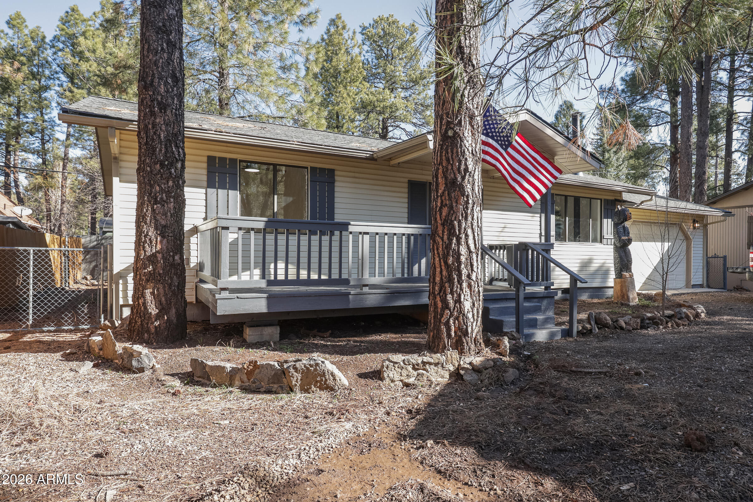 Escape to the cool mountain air and towering pines of Munds Park with this completely updated, furnished cabin. Nearly everything buyers care about has already been done, allowing you to simply arrive and start enjoying mountain life.

Inside, the home features all new high end LVP waterproof flooring, a completely remodeled kitchen including new cabinets and quartz countertops, and two fully updated bathrooms, creating a fresh, modern interior while still maintaining the warmth and charm of a classic cabin retreat. Major systems have also been taken care of, including a new HVAC system that is ducted to every room and includes air conditioning (No ugly mini-splits here!), plus a roof and water heater replaced just two years ago, providing valuable peace of mind. Outside, you will find a covered patio and an open deck.  Additionally there are 3 sheds on the property.

One of the most sought-after features in Munds Park is included here -- an attached garage, offering rare and valuable space for vehicles, mountain toys, bikes, or extra storage. The SxS in the garage is even available on a separate bill of sale!

Whether you're looking for a weekend getaway, summer escape from the Phoenix heat, or a full-time home in the pines, this property delivers the perfect balance of comfort, upgrades, and location. Step outside and enjoy nearby forest access, ATV trails, hiking, and the peaceful lifestyle that makes Munds Park so special.

Updated homes with a garage in Munds Park are hard to find -- this is a rare opportunity to own a move-in ready cabin in the pines.

Owner/Agent