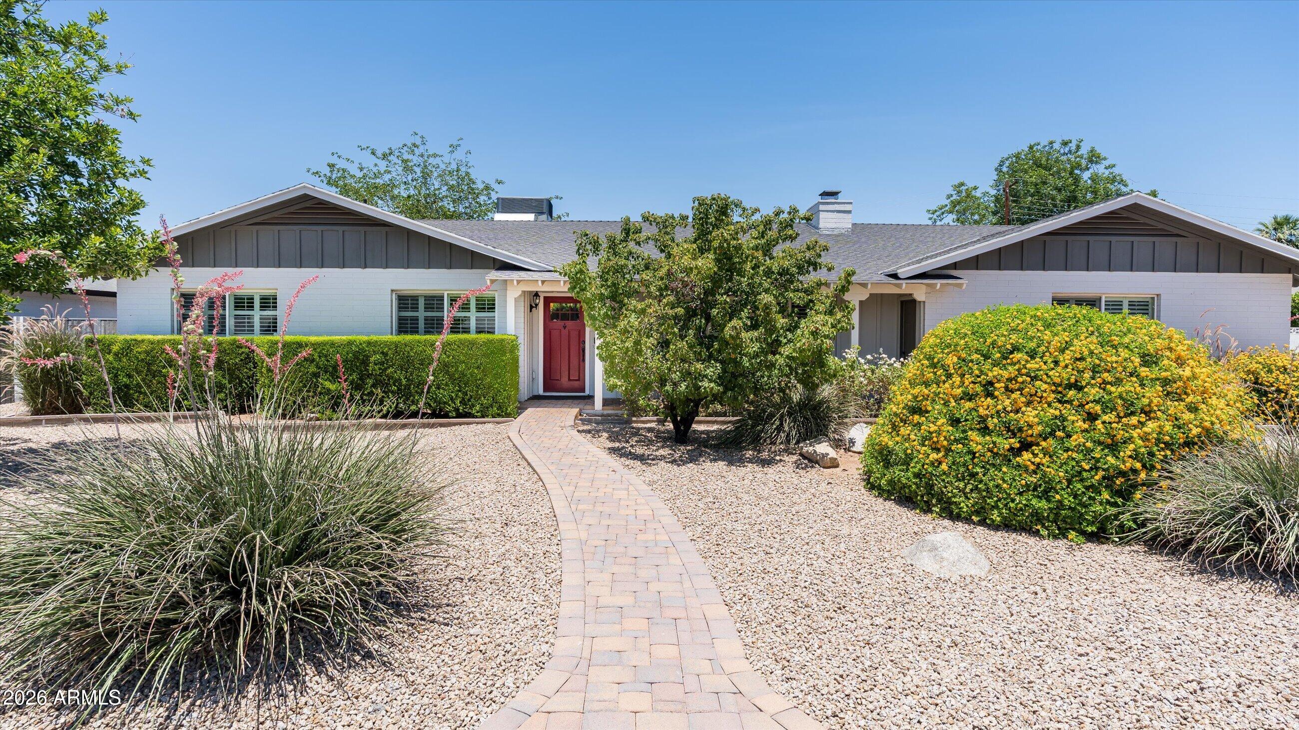 Tucked into one of Arcadia Lite's most coveted streets, this beautifully updated single-level ranch is move-in ready and minutes from the neighborhood's best dining and coffee that define the area. Three bedrooms and two and a half baths unfold across a thoughtful single-story layout, with a fully renovated kitchen anchored by polished marble countertops. Refreshed bathrooms carry the same elevated finish throughout.

Step outside to a private backyard retreat built for Arizona living: a sparkling pool and spa framed by lush, manicured landscaping, with room to lounge, dine, and entertain under the desert sky. The result is a rare combination, a turnkey home in a highly sought after, walkable neighborhood.