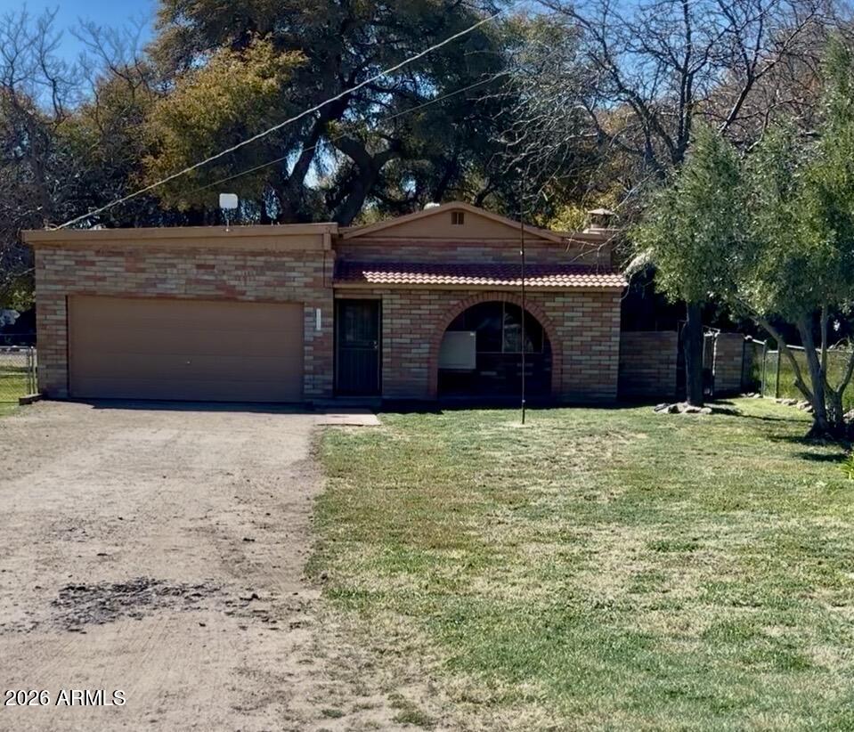 2 bedroom 2 bath, located in beautiful, quiet Yarnell in the Glen Ilah subdivision. Recently upgraded, with some dual-pane windows, new kitchen cabinets, fresh paint, and new baseboards. New vinyl wood flooring in the kitchen, bedrooms, hall, and bathrooms. Spacious kitchen with a large pantry and a living room with space for entertaining, has two steps to back part of house. Large fenced backyard with double gates, room for a garden. Large front yard with extra-long driveway and 20X18 garage. Mature fruit trees and shade trees. Evaporative cooling and gas heat. Block, stone, and some frame construction make for a very insulated space. Beautiful 1'' natural sandstone floors in the living room and natural stone fireplace, including options for gas, wood, or electric. Short distance to the post office. Beautiful mountain views from the living room.