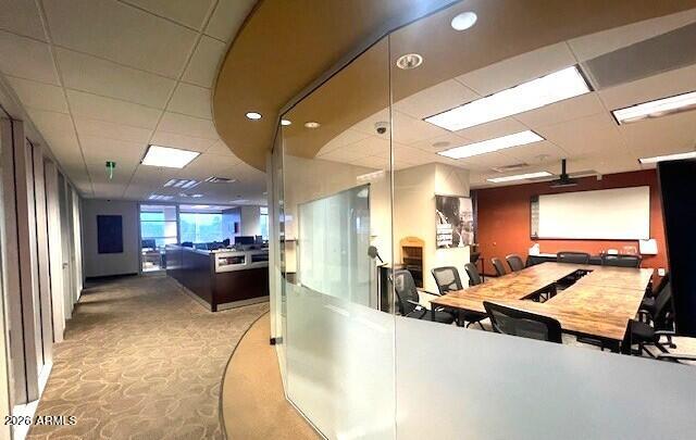 Incredible, 5,849sf professional office space new to the market. This space is literally move in ready with excellent top floor views to the north, south and west. Beautiful executive lobby, up to 12 extremely luxurious offices, 2 large conference/training rooms, and 2 or 3 break rooms/ copy areas as well as an existing open area currently set up for professional open workspaces. This space is truly unbelievable. Among the current amenities are immediate access from elevators and main core lobby, top position on massive monument sign on Indian School Road, private keyless secured entry, private security system, private camera system, private new mini split air conditioning system  used for data room, 4 owned, specifically designated, covered and reserved parking spaces plus a large unreserved parking field available. Offices are fitted with all glass floor to ceiling or partial glass walls with metal frames and solid core or glass insert doors. New hard cap and 2x2 ceilings with energy efficient parabolic lighting, sophisticated flooring designs, terrific built ins... too much to mention.