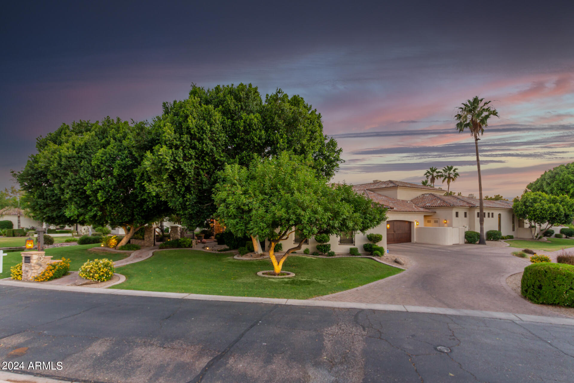 HUGE PRICE DROP!! IGNORE DAYS ON MARKET!! NEW LOW PRICE!!This exquisite lake front custom home resides in the exclusive gated subdivision of Crown Point, a private community with only 11 lots. It provides easy access to the Ocotillo Golf Club, a premiere golf destination in Chandler, Arizona.
This Spanish/Mediterranean home has 5 bedrooms and 6 1/2 bathrooms. There are 3 bedrooms on the main floor, 2 being ENORMOUS full master suites, each on opposite ends of the home. There are 8760 sq ft of living space, plus 1156 sq ft in attached casita. The casita has a separate entrance, with bar and bathroom with easy access from the pool and patio.
The kitchen has  new appliances. 4 Viking convection ovens, 8 burner Viking stove, 36'' Viking fridge 36'' Viking freezer, and 2 DW and 2 Ice makers Two islands in the kitchen make entertaining effortless. The under the staircase wine cellar is amazing, with stone clad walls and clay slots.Upper level includes 2 bedrooms, 2 bathrooms, game room/lounging area, bar with mini kitchen and fireplace. You can view the gorgeous Arizona sunsets from a private patio just outside.The negative edge pool was  resurfaced and equipment replaced. There is also a spa and fire pit for your enjoyment.
All the bathrooms were remodeled. The roof was just replaced at a cost or  $300, 000.00, and four of the five AC units were recently replaced.

All of this and more in this Magnificent Move In Ready Home!!