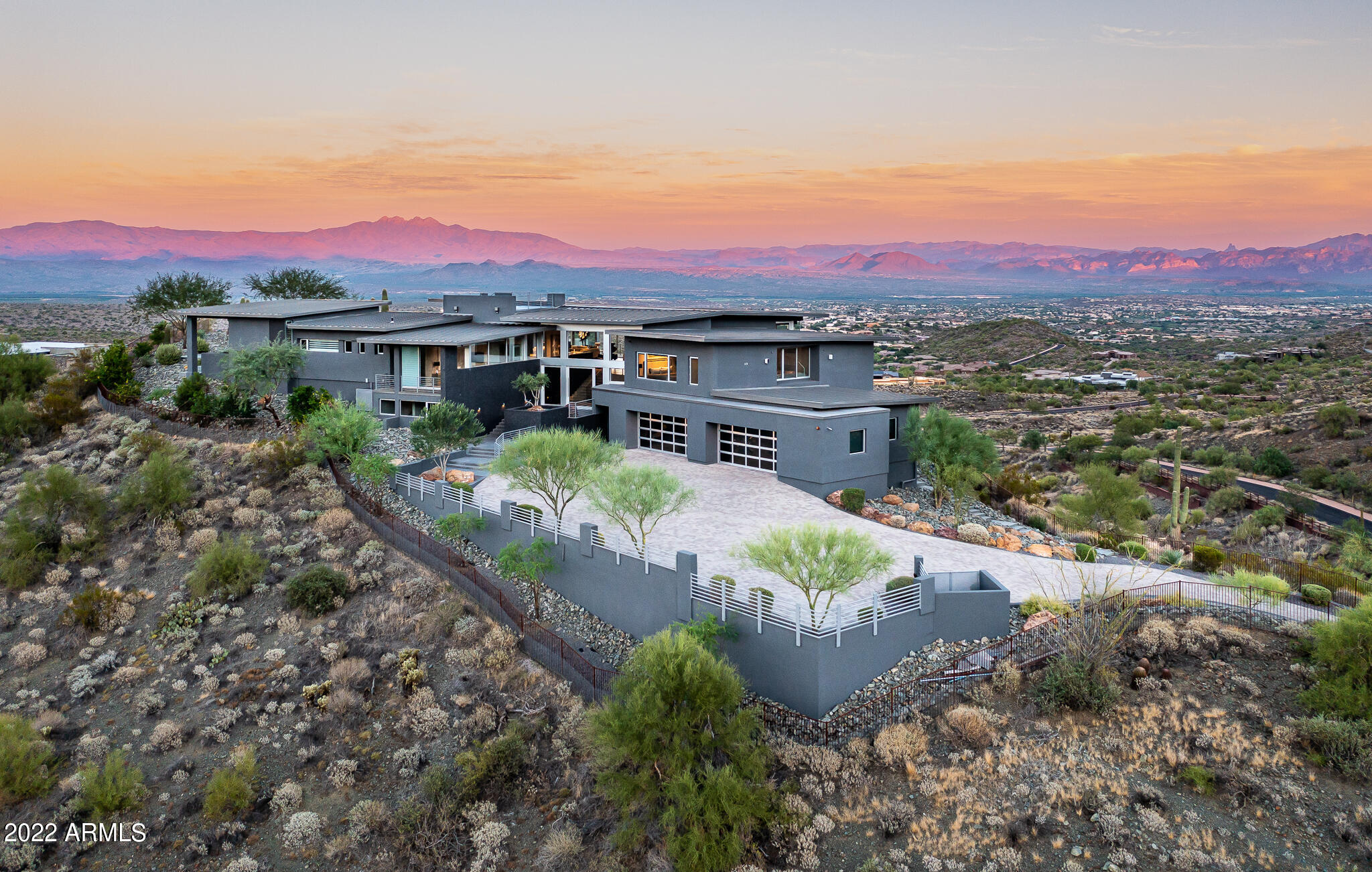 Jaw-dropping views from every window, door, & patio in this spacious contemporary masterpiece. Perfectly situated at the top of this 4 acre lot in guard-gated Eagles Nest with true 360 degree views. Cohiba Natural Italian Granite focal walls at entrance, Brazilian Teak ceilings, and Italian Basalt stone flooring. Kitchen offers Bulthaup cabinetry and counters, Wolf and Sub-Zero appliances. Elegant primary bedroom wing has automated blinds, access to private patio, Black Onyx negative edge Pebble Tec pool and spa, outdoor shower & exterior pool bath. Freshly painted inside and out, updated lighting fixtures, ceiling fans, added fireplace in LR and all baths have had updates. Excellent entertaining areas inside & out. Turnkey home with furnishings and artwork availab Control 4 security and sound system.

5 high efficiency Carrier Infinity HVAC units and 2 Mini splits in garage.

Rinnai High Efficient gas tankless water heaters

Outdoor kitchen includes grill, rotisserie, gas range, pizza oven, warmers, fridge and stainless-steel sink

Automated blinds are Hunter Douglas Pirouette and have a web based app for managing (office, primary bedroom, and bonus room)

Lutron automation for secondary lighting (lamps, wine room, and special highlighting)

Negative edge saltwater pool and negative edge spa with 4 water features, High efficiency commercial pool water heater, Black Onyx Pebble Tec finish on both pool and spa, Electronic pool cover, Wi-Fi enabled pool system with multi-Color pool and spa lighting

Garage is 27' 10" from door to wall and 25' 9" from door to cabinets, 5th bay is at the back wall of the garage and is 13' x 20' equipped with a drain