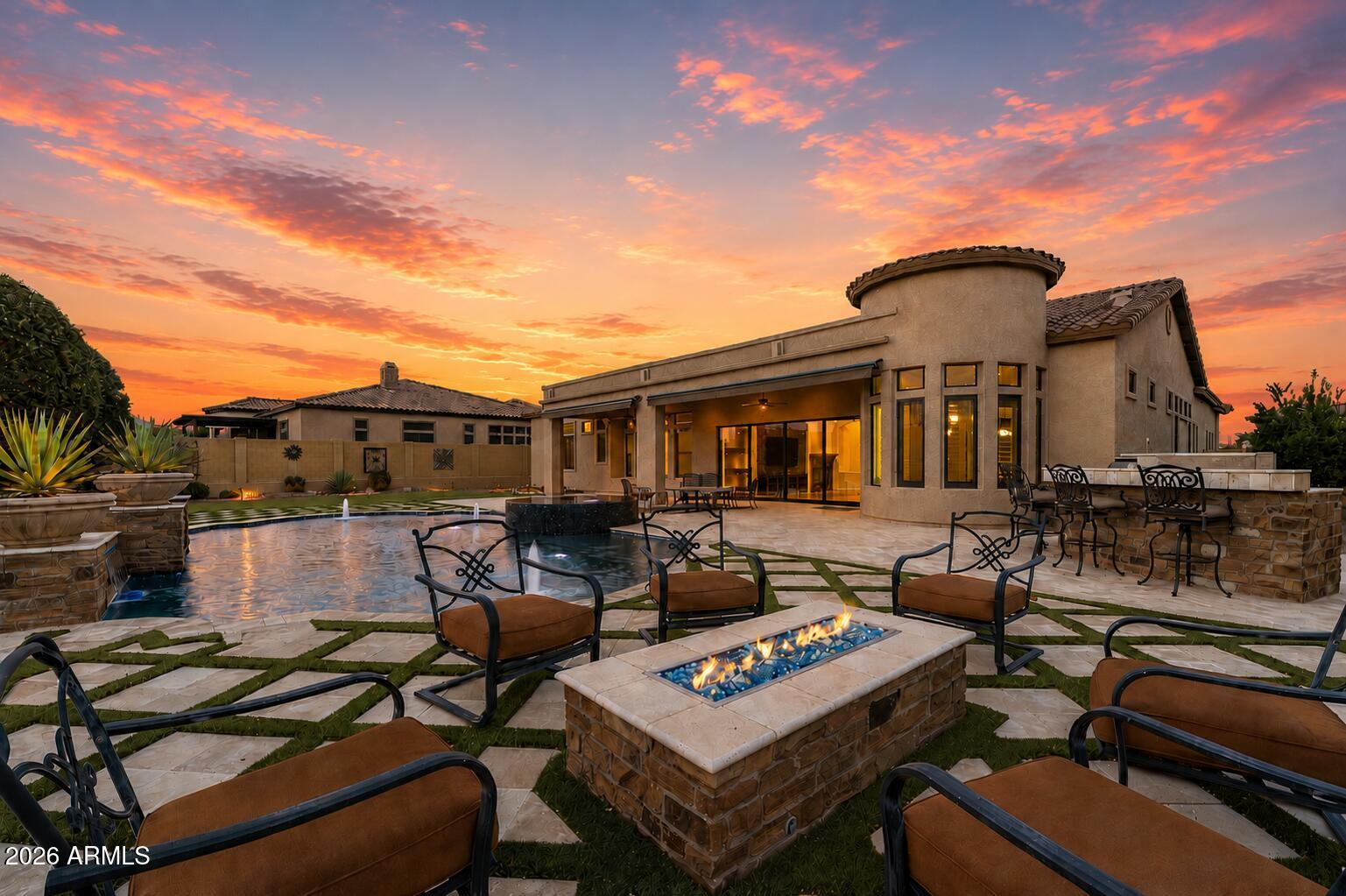 PREMIUM VIEW LOT | DUAL PRIMARY SUITES | RESORT BACKYARD | BRAND NEW AC UNITS

Set on nearly half an acre within Mesa's prestigious Mountain Bridge community, this exceptional residence blends timeless luxury with thoughtful design in one of the East Valley's most sought-after gated neighborhoods. Backing to an open wash with mountain views, the home offers a rare combination of privacy, expansive outdoor living, and a floor plan designed for both everyday comfort and effortless entertaining.

Inside, soaring ceilings, oversized bedrooms, designer finishes, an open-concept layout, and three brand-new HVAC systems create a home that is as comfortable and efficient as it is beautiful.A highly sought-after split floor plan with dual primary suites and ensuite baths in every bedroom offer exceptional flexibility for multigenerational living, long-term guests, or growing families. Step outside to your own private resort, where a heated pool and spa, outdoor kitchen, fire pit, expansive covered patio, and stunning mountain views create the ultimate setting for entertaining or relaxing year-round.

Mountain Bridge is more than a neighborhood. It's a lifestyle. Enjoy gated privacy, resort-style amenities, scenic walking trails, parks, tennis and pickleball courts, a fitness center, and one of the East Valley's most desirable master-planned communities.