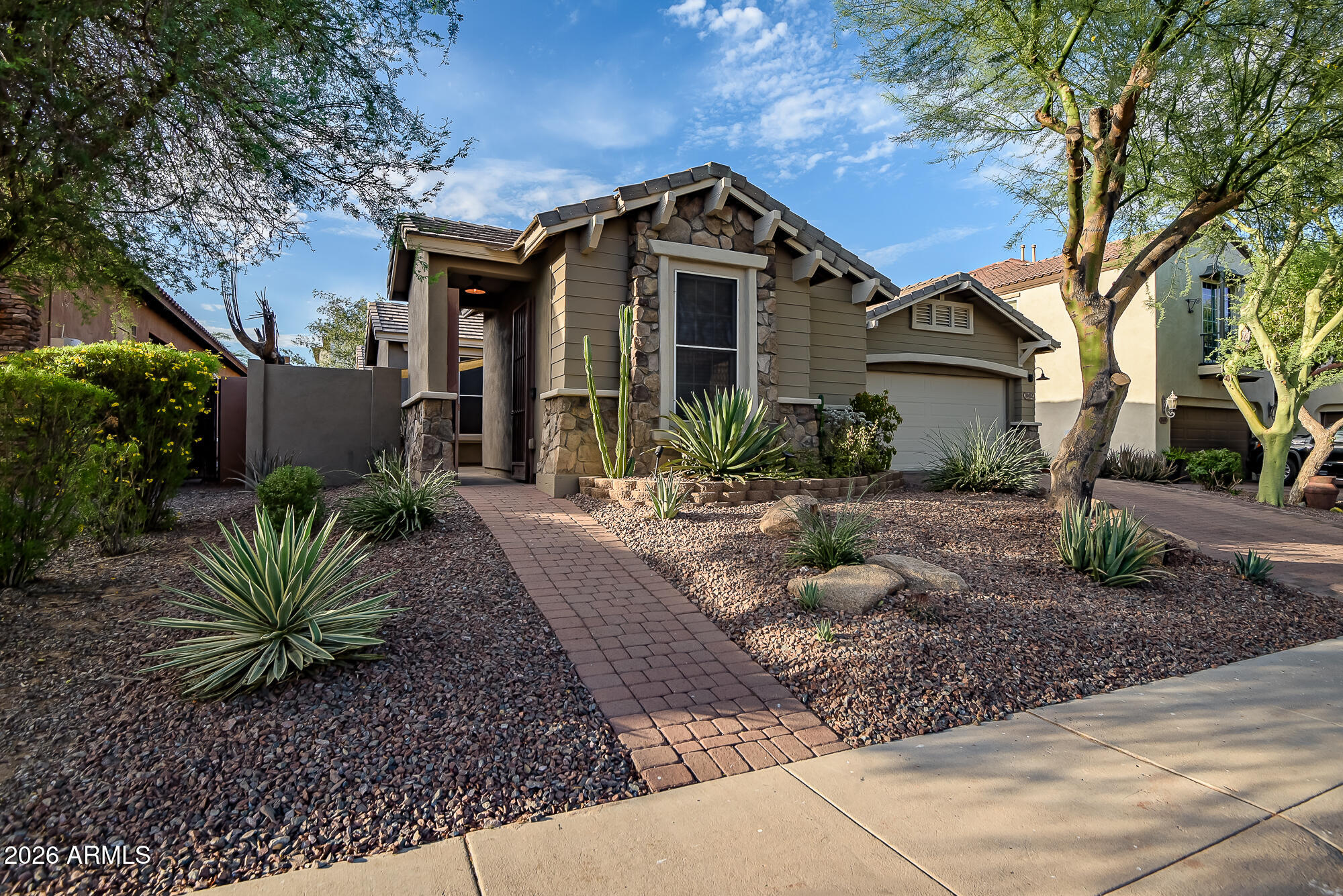 Beautifully updated 3-bedroom, 3-bath home with a dedicated office and numerous recent upgrades. Fresh interior and exterior paint give this home a clean, move-in-ready feel. The kitchen features slab countertops, dual ovens, and reverse osmosis water filtration. Enjoy a freshly remodeled primary bathroom and the savings of owned solar. Major improvements include new roof underlayment (May 2026), new AC and furnace (2025), and new water heater (2025). The garage offers epoxy floors and its own AC, creating the perfect space for hobbies, a gym, or workshop.  Beautifully landscaped backyard with two seating areas, a pergola, low-maintenance turf, and mature gardens.The perfect space to relax, entertain, and enjoy Arizona's beautiful weather. Welcome to comfort, efficiency, and convenience.