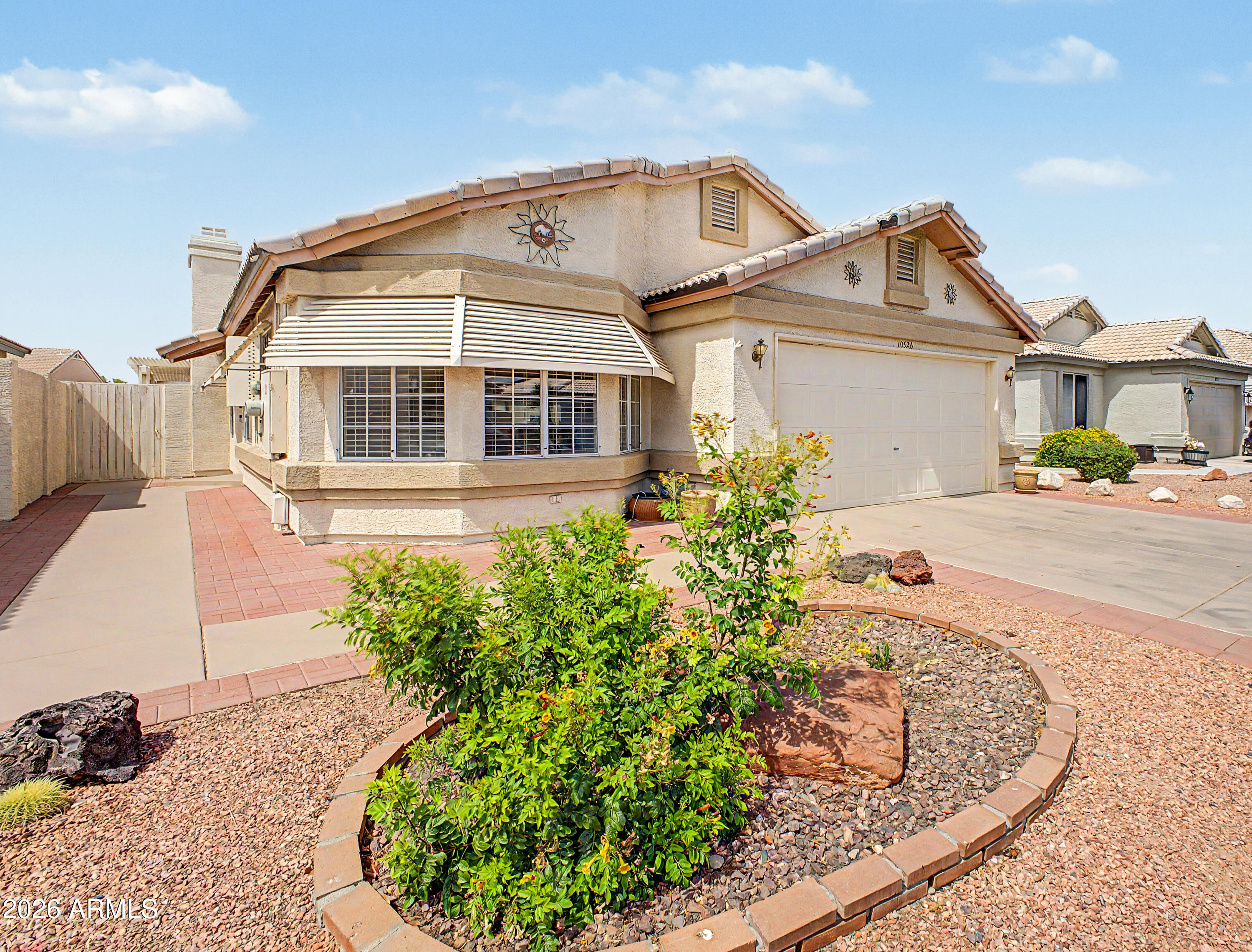 Experience the best of waterfront living in one of Peoria's premier 55+ communities of Ventana Lakes! This 3-BR, 2-BA home welcomes you with vaulted ceilings, wood and tile flooring, and a warm, inviting floor plan. The eat-in kitchen features bay windows, S/S appliances, ample cabinetry, and sleek quartz countertops, offering an ideal space for everyday living and entertaining. A formal dining room adds versatility for hosting gatherings or creating a home office space. Unwind while taking in tranquil lake views from the full-length covered patio. The spacious primary suite serves as a private retreat and features a walk-in closet and an en-suite shower plus step-in tub for added comfort and convenience.The desirable split floor plan features two guest rooms with deep closets providing... ...generous storage and flexibility for guests or hobbies. Enjoy the active lifestyle in a home perfectly situated on the water and close to the rec center in a community with scenic lakes, walking paths, pools, spas, fitness center, pickleball/ tennis courts, clubhouses, and a variety of social activities!
