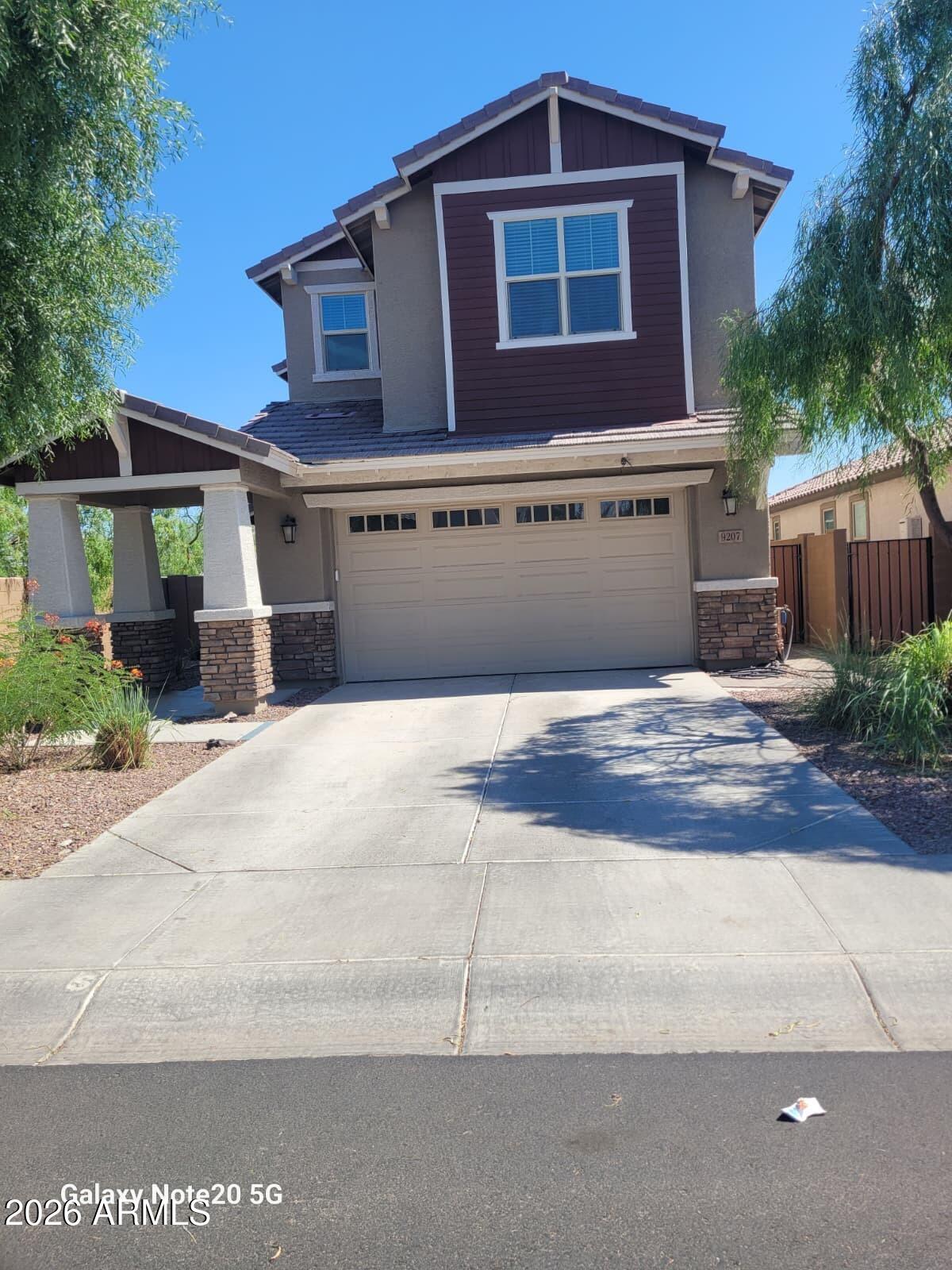 Beautiful home, nestled in the gated Western Enclave Community! Welcoming interior showcases recessed lighting, wood-look tile flooring, soft palette, & a den/office. Spacious great room w/Arcadia door to the backyard is excellent for entertaining. Immaculate kitchen boasts plenty of white cabinets, a two-door pantry, quartz counters, SS appliances, & an island w/a breakfast bar. A den is ideal for an office. Upstairs, you'll find the carpeted primary retreat comprised of a pristine en-suite w/dual sinks & a walk-in closet. The expansive backyard with a relaxing covered patio and low maintenance synthetic grass and pavers! Tastefully done. Don't miss out! Just pack your back and move in!