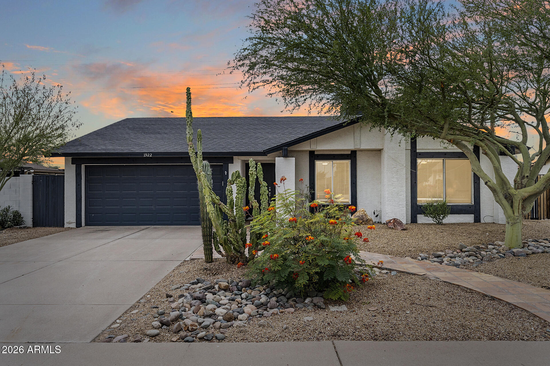 Remodeled, move-in ready, and designed to impress! This 3 bedroom and 2 bath home on a large lot with NO HOA is the total package! Featuring sleek vinyl and plush carpet flooring, the home showcases custom cabinetry, stone countertops, and beautifully updated vanities throughout. The bright, airy kitchen shines with white cabinetry and comes complete with refrigerator, washer, and dryer. A 2-car garage adds convenience, while the backyard steals the show enjoy a heated pool year round surrounded by lush landscaping, artificial turf, pathways, shade trees, shrubs, and striking desert accents. A covered patio creates the perfect space for relaxing or entertaining. Ideal for a growing family or as a rental opportunity, this home offers style, comfort, and value!