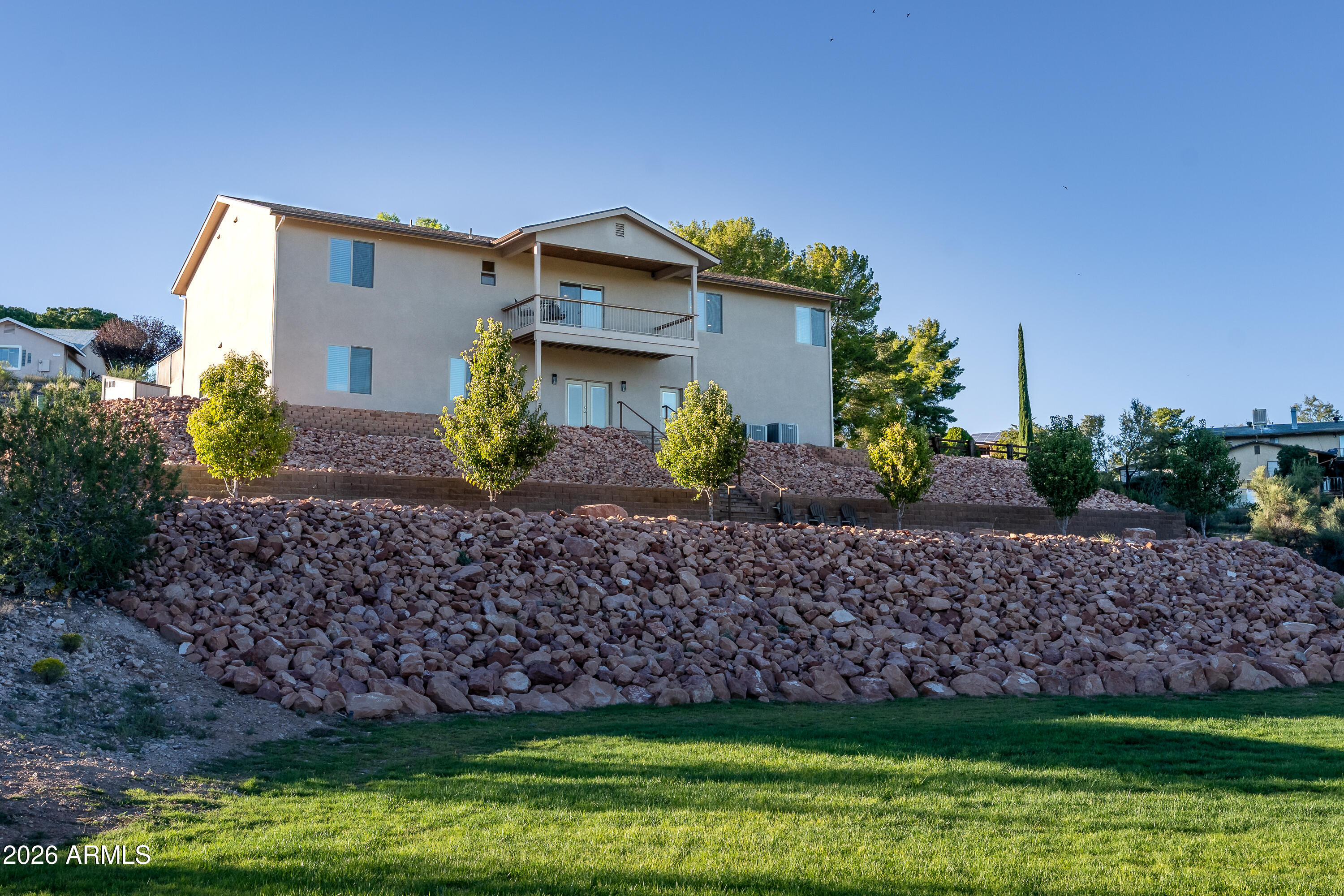 Welcome to Bow Maker Trail — a brand-new, custom-built dual-living estate on just over 1.5 acres, centrally located less than a mile from Walmart, Home Depot, and Mingus Union High School, and only two miles from Verde Valley Medical Center. Surrounded by panoramic Verde Valley and Mingus Mountain views, this 6-bedroom, 4-bath masterpiece offers 3,950 sq ft of livable space (5,030 sq ft under roof). Two complete homes in one—each with its own kitchen, private entrance, and potential for a divided garage—perfect for multigenerational living or live-up/rent-down flexibility.

Every inch was engineered for comfort and efficiency: spray-foam insulation, CAT-6 wiring, central vacuum with toe-kick sweeps, and EV charging setup. A brand-new septic and well system ensure long-term Every inch was engineered for comfort and efficiency: spray-foam insulation, CAT-6 wiring, central vacuum with toe-kick sweeps, and EV charging setup. A brand-new septic and well system reliability, while the irrigated, football-field-sized lawn and low-voltage exterior lighting create a stunning outdoor retreat.

Enjoy sunsets, easy maintenance, and a property where design, technology, and comfort meet.

Offered at $1,499,000   this is more than a home; it's an engineered lifestyle.

Details:

2,346 sq ft Upper | 1,604 sq ft Lower = 3,950 sq ft livable (5,030 under roof)

1.51 acres total two contiguous parcels (APNs 406-49-233 & 406-49-234) conveyed together.